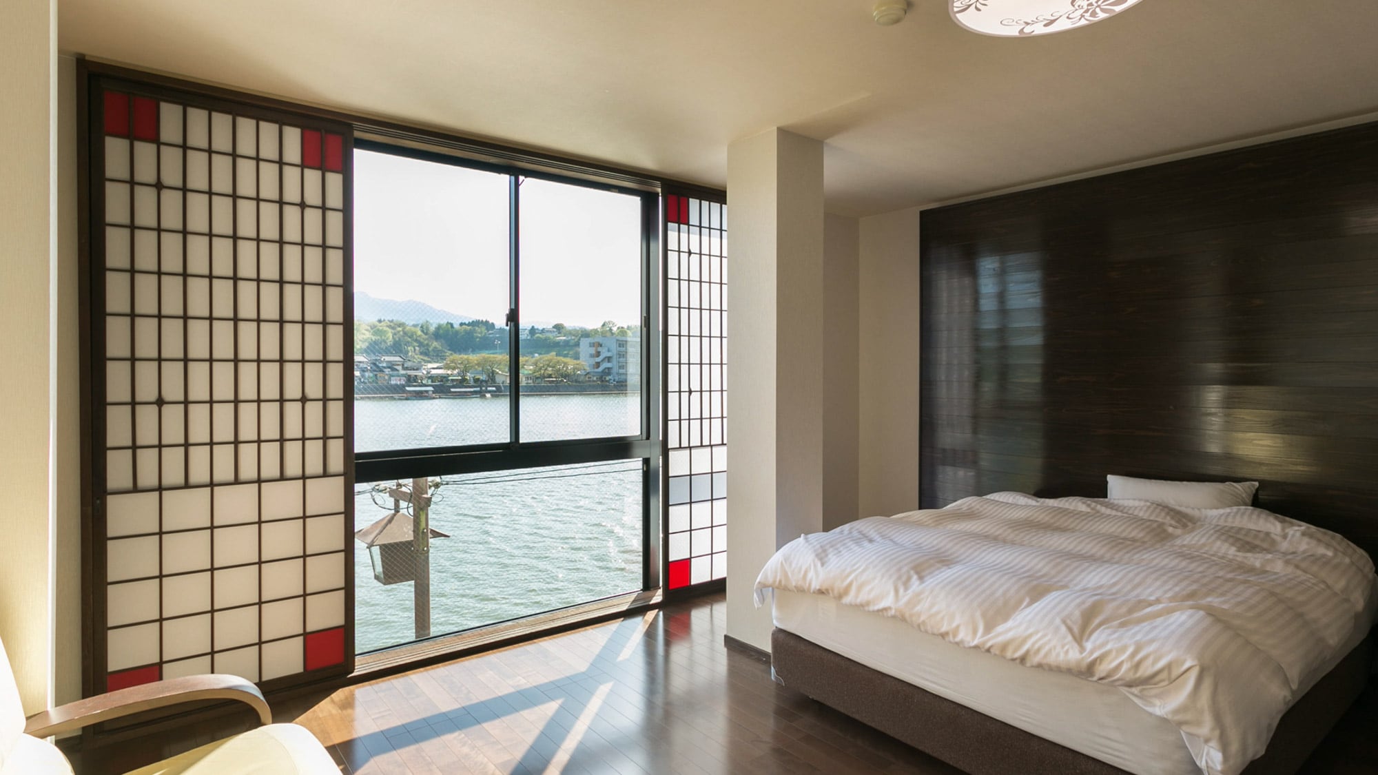 [Room] River view with bright light streaming in through the large windows.