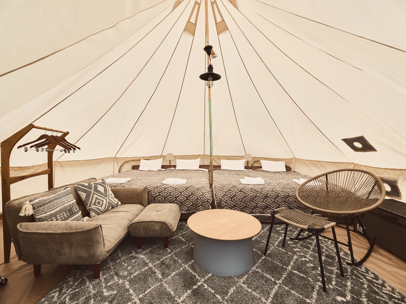 Glamping tent interior with 4 single beds