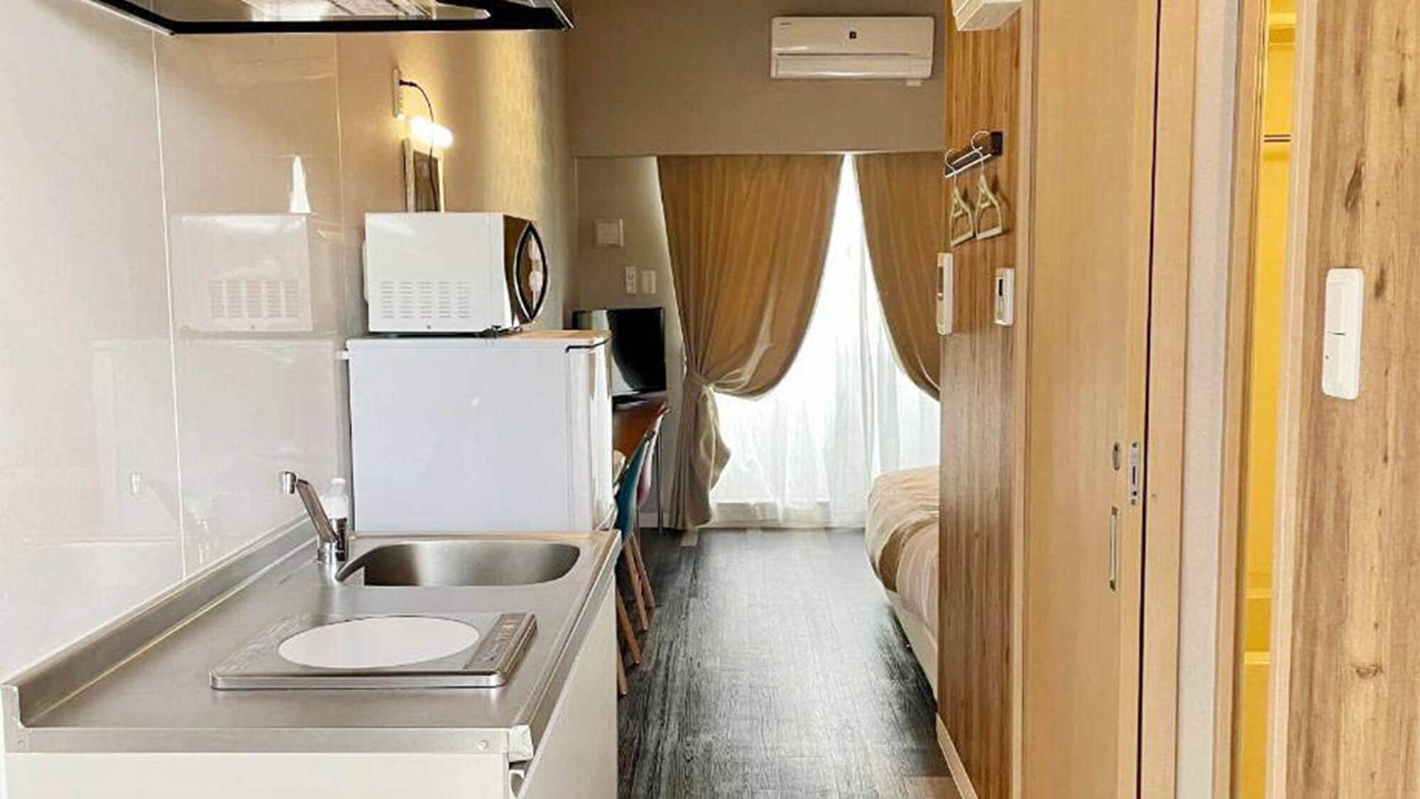 ・[Double bedroom] Equipped with a refrigerator and microwave. You can stay as comfortably as if you were in your own room.