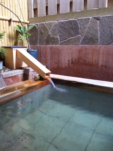 Near the outlet of the open-air bath
