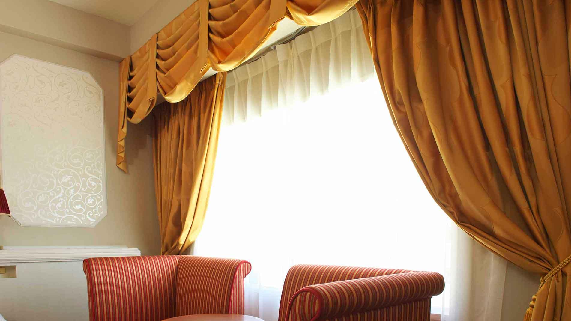 The windows of the moderate room (castle style) have drape curtains that look like a castle.