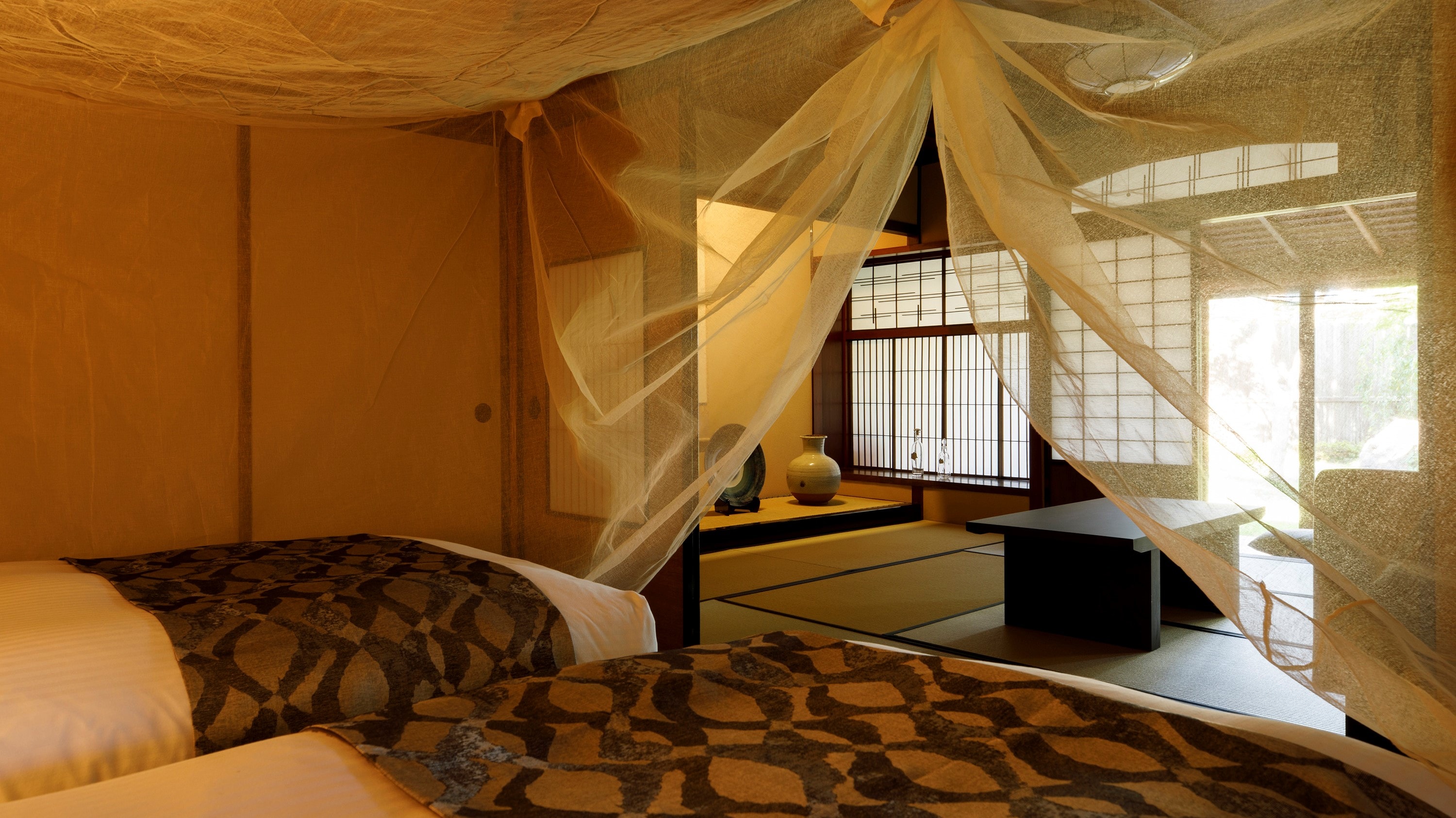 [Where the Clouds Go] You can look out over a private garden from your bed.