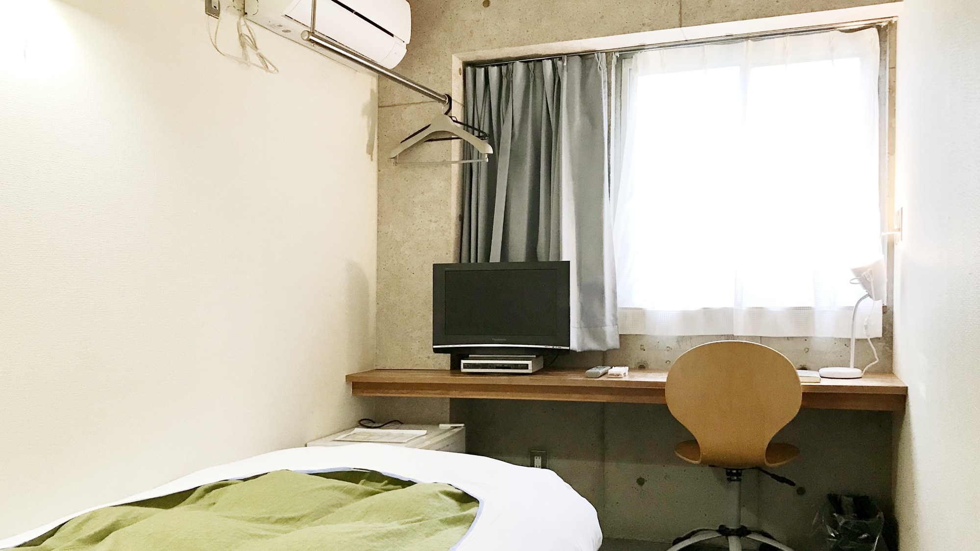 Single with TV and refrigerator