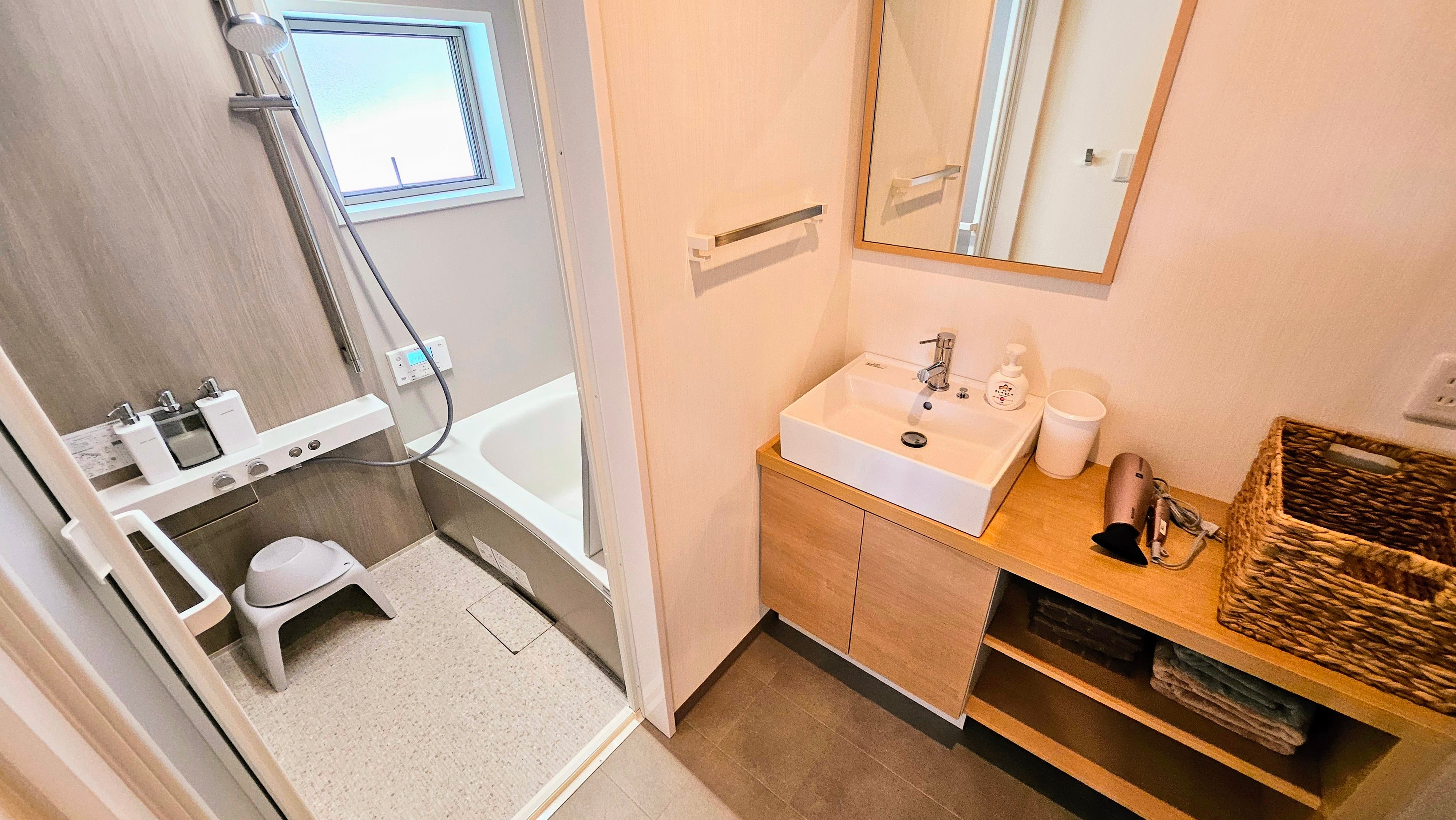 The bathroom in the Main House is comfortably designed with a clean wash area.
