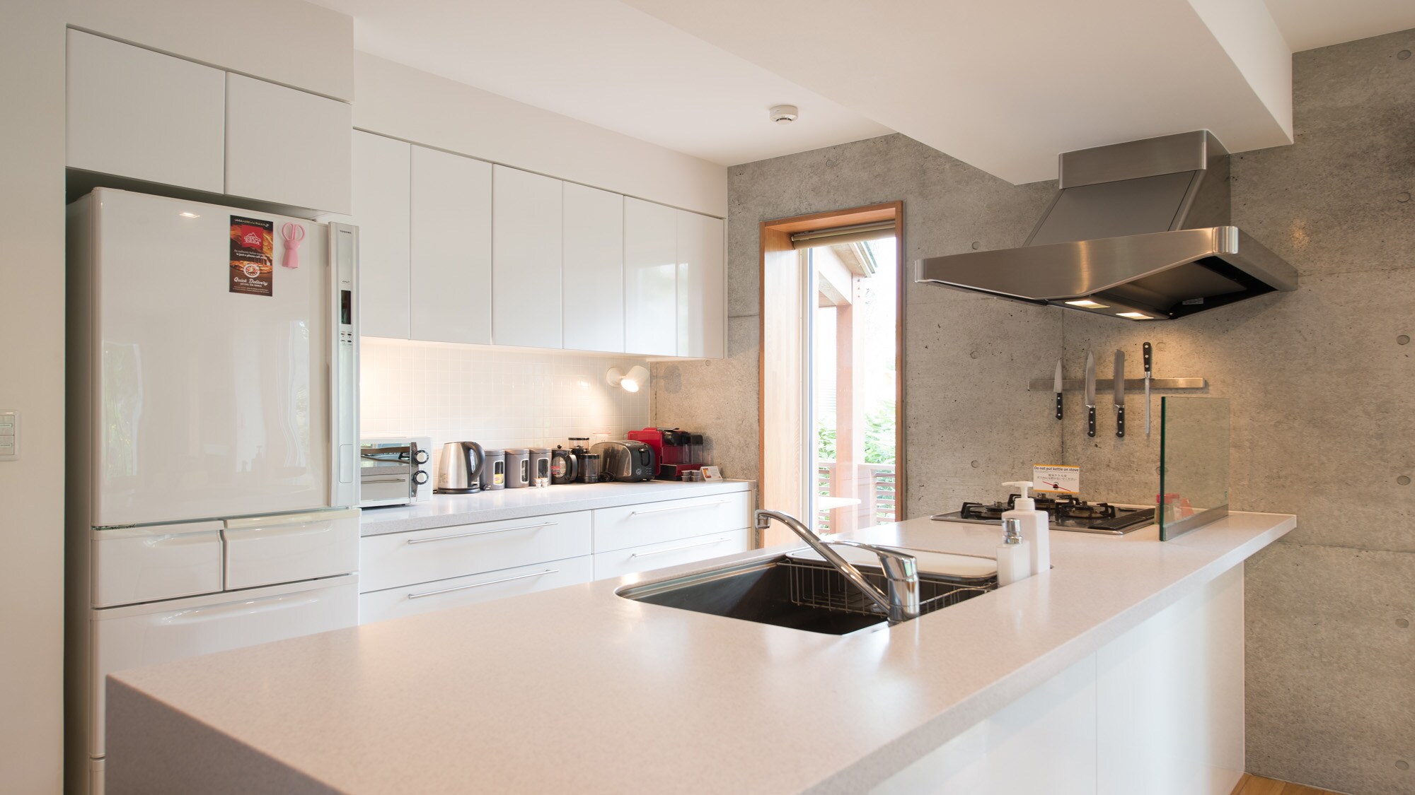 Kitchen equipped with cookware and cutlery