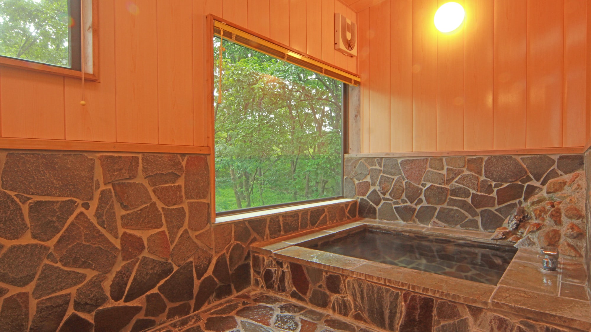 The two private baths have large windows from which you can enjoy the view.
