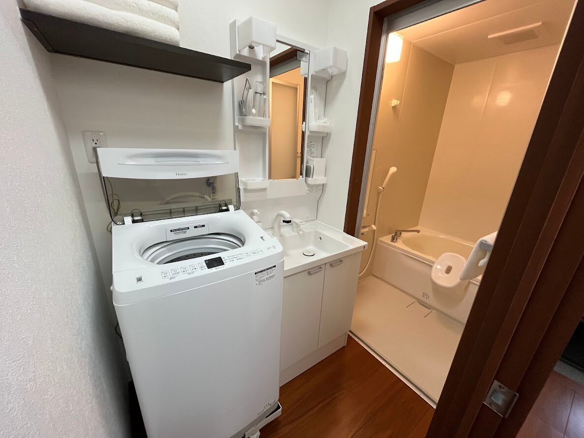 Washing machine, washroom, unit bath (Room 201)