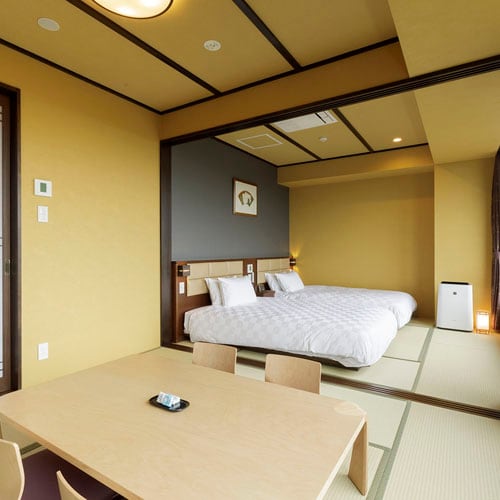 Superior A [Japanese-style room + Japanese-style room twin] A bedroom with two Japanese-style beds on a tatami-matted floor and a Japanese-style room with a continuous room.