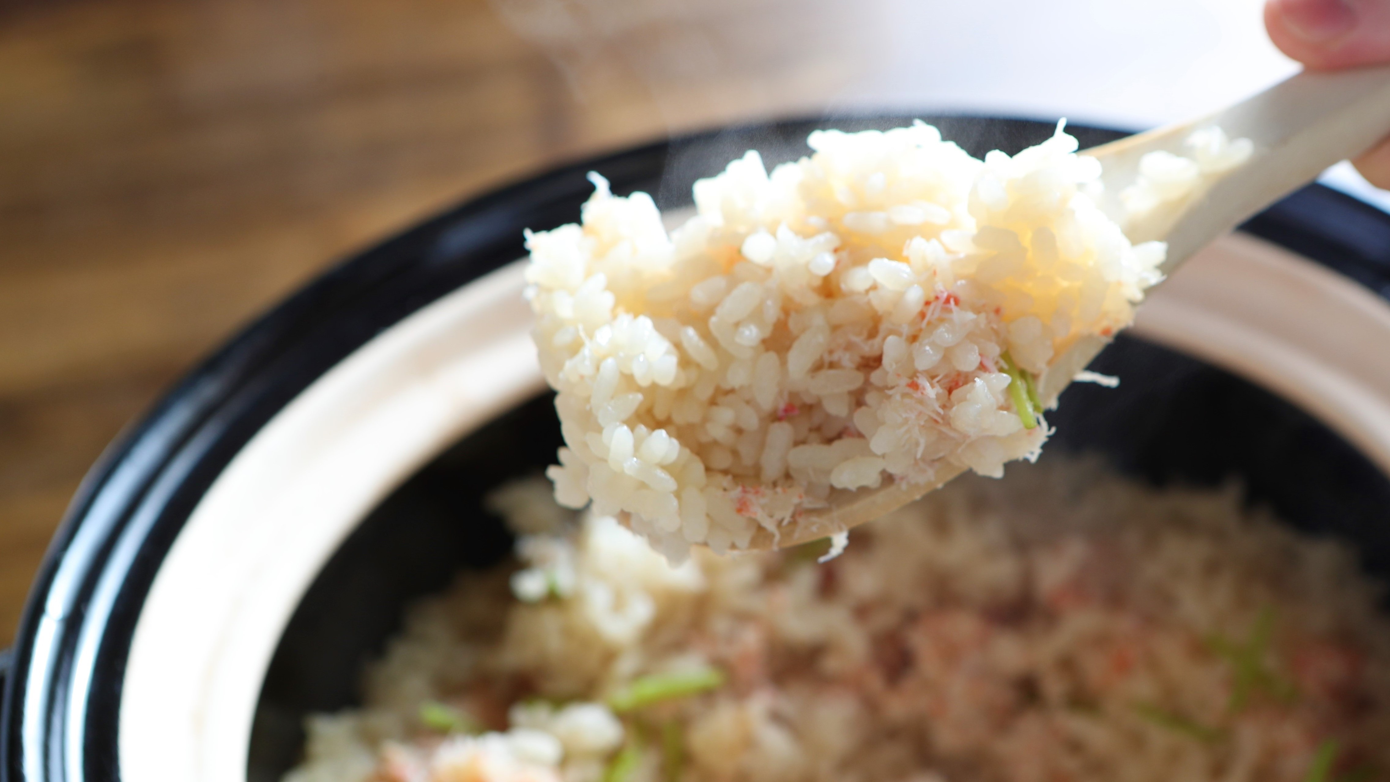 Image of rice cooked in a clay pot