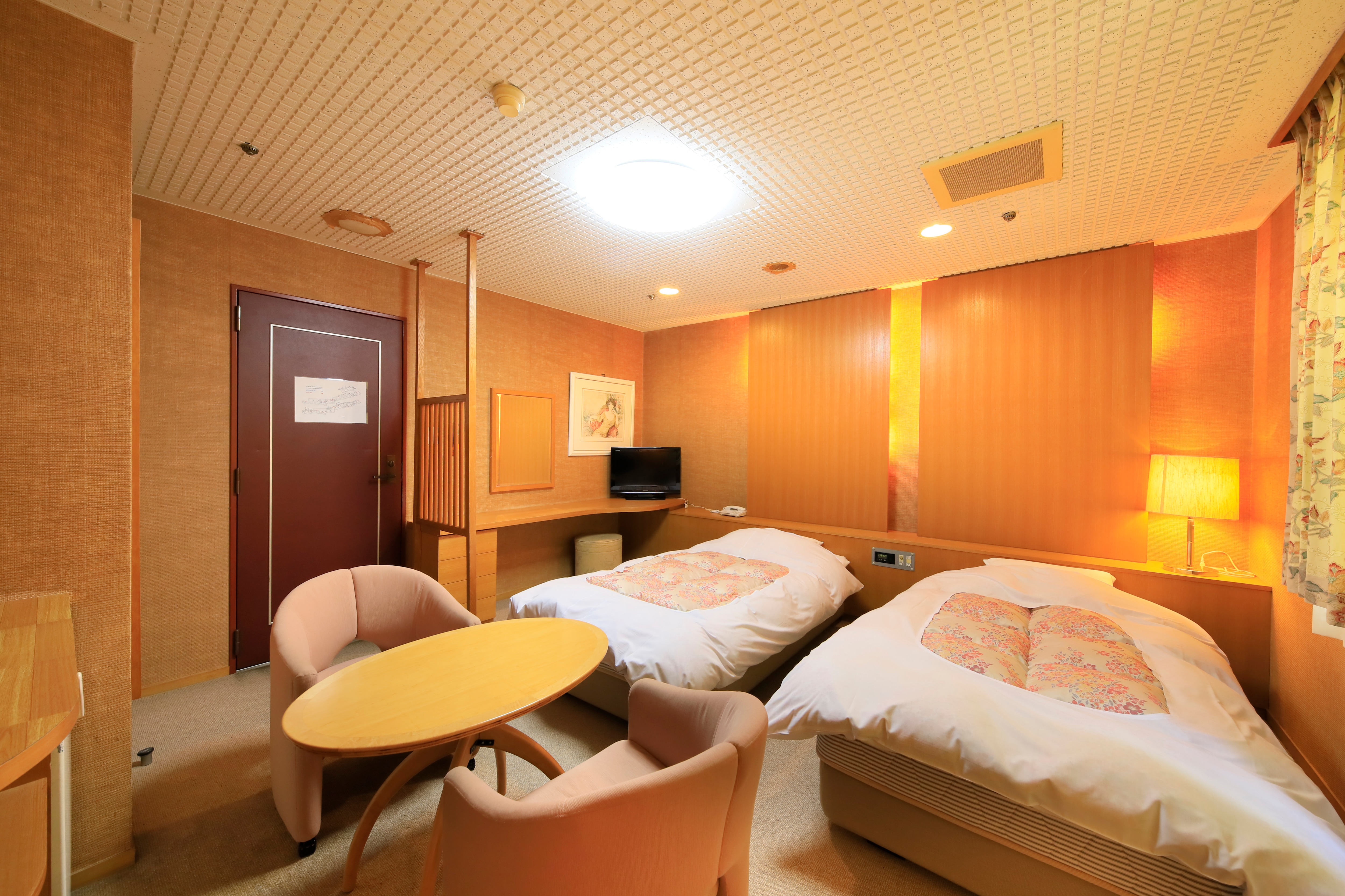Mountain-facing twin-bed room.