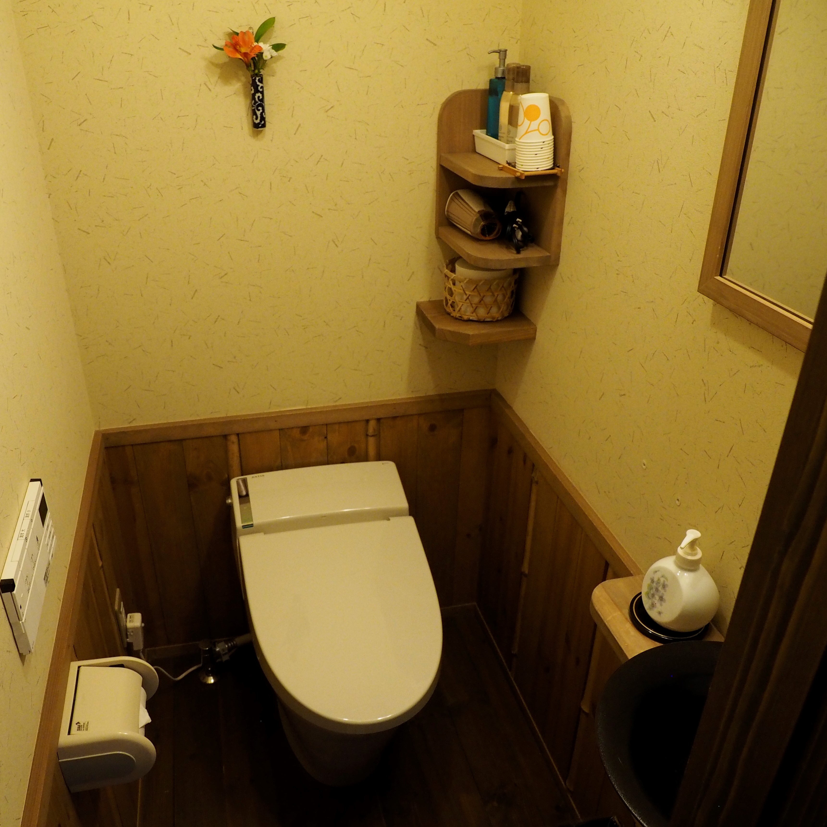 A small toilet with a washbasin in an 8 tatami Japanese-style room