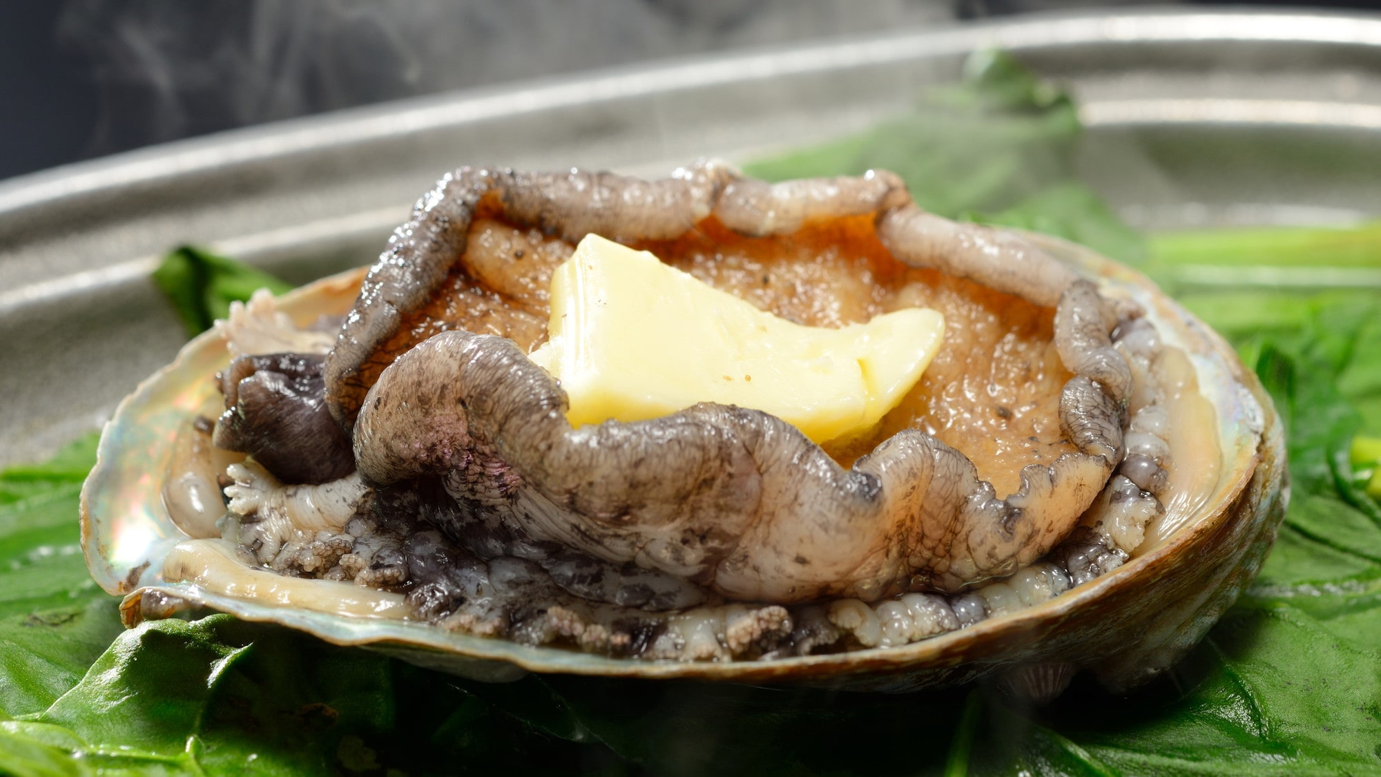 Our specialty "live abalone grilled on a ceramic plate"