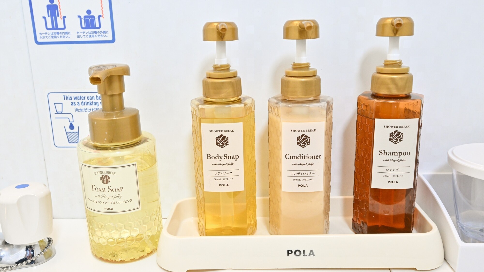 Shampoo, body soap, conditioner, and face wash are available in the bathroom.