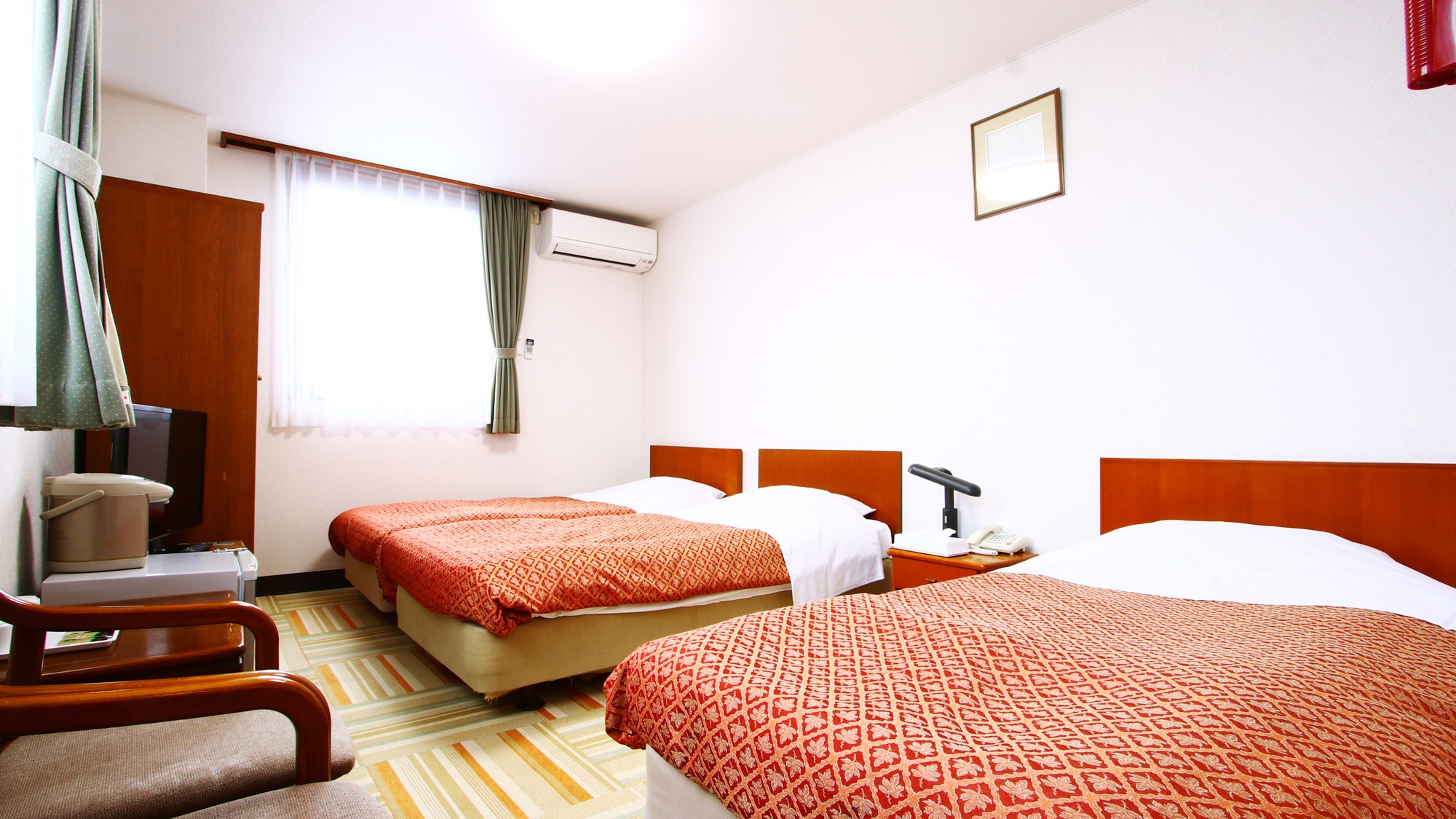 Main building twin room. Some rooms can accommodate up to 3 people with an extra bed.