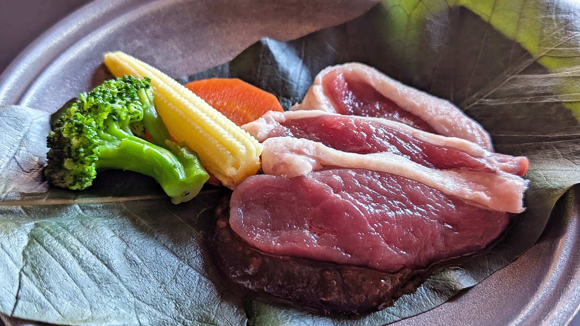 Summer duck grilled on a magnolia leaf (seasonal)