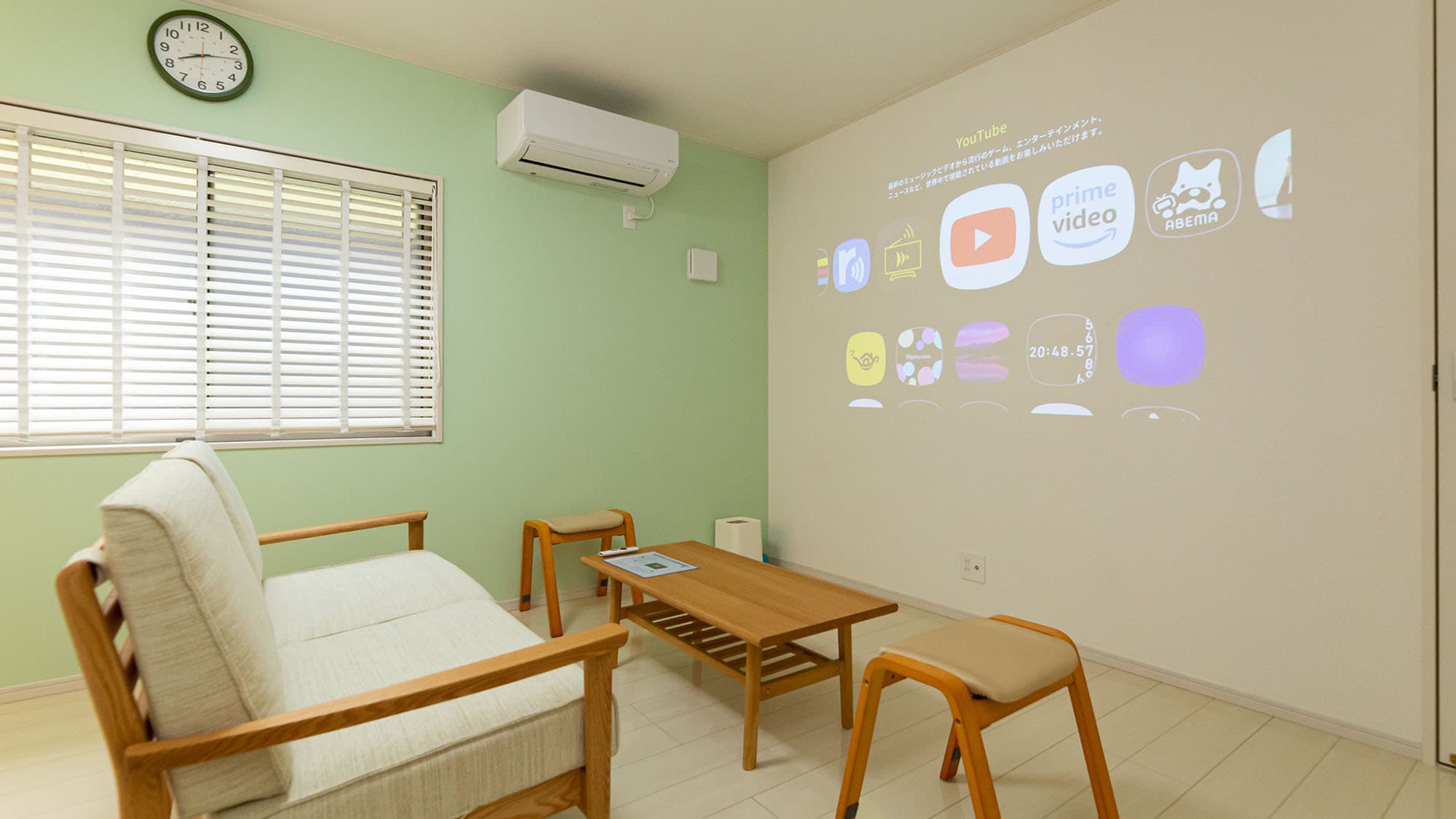 [Building A, Living Room] Enjoy the projector installed on one wall.