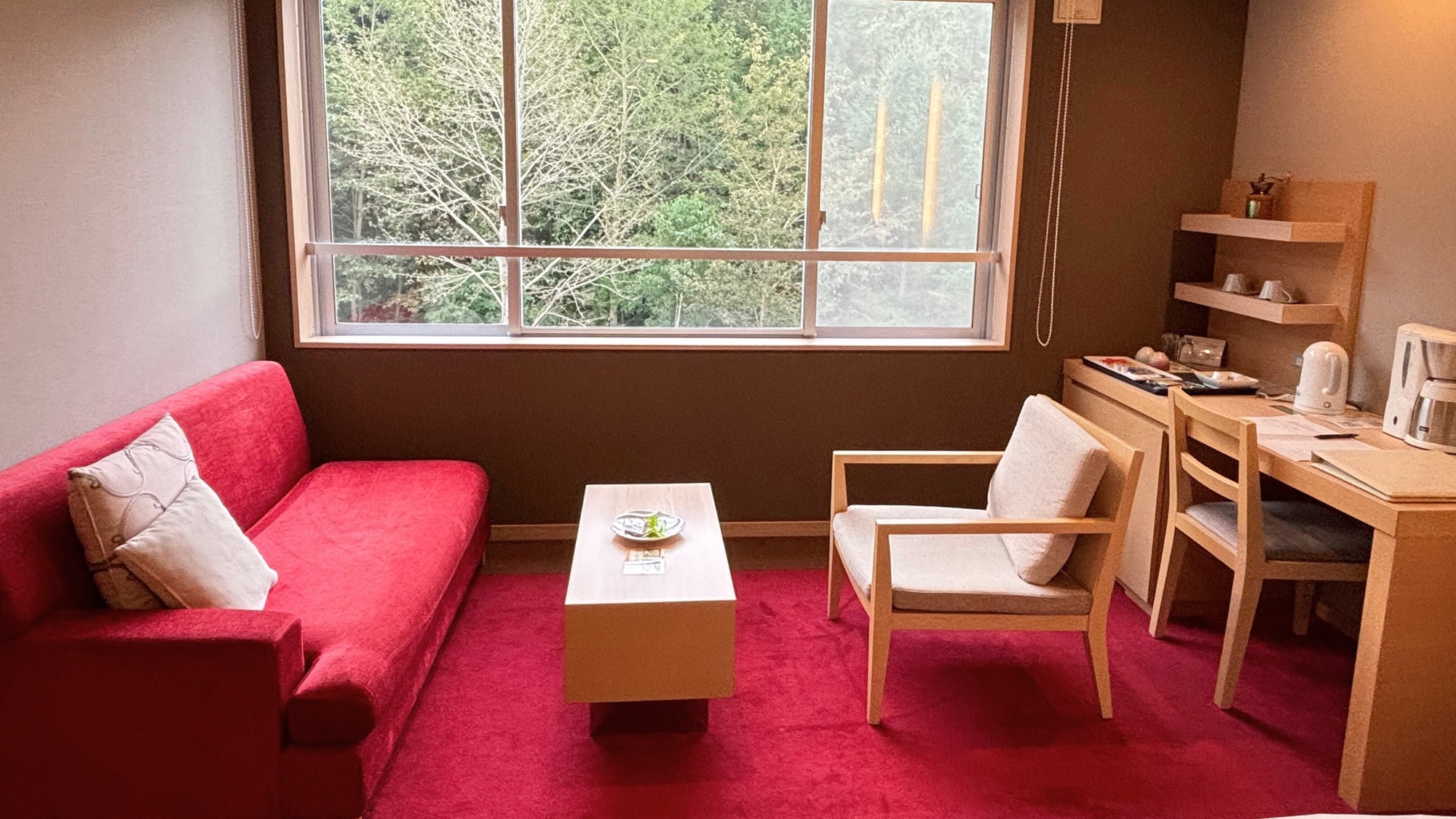 [Ladies' Room] A small living space by the window where warm sunlight pours in.