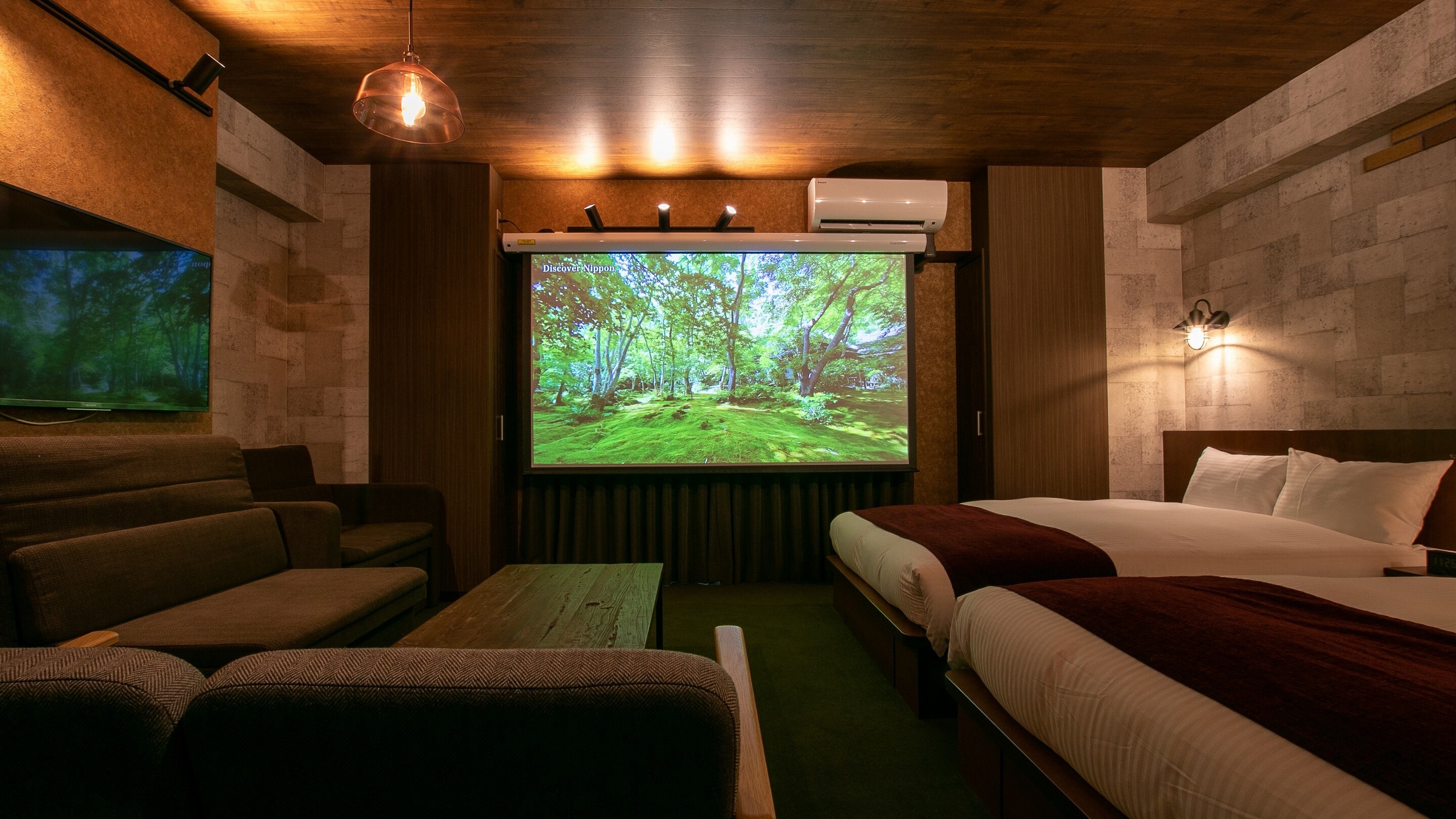 This room comes with two double beds and one sofa bed, as well as a large, impressive screen ☆ Enjoy your time here!