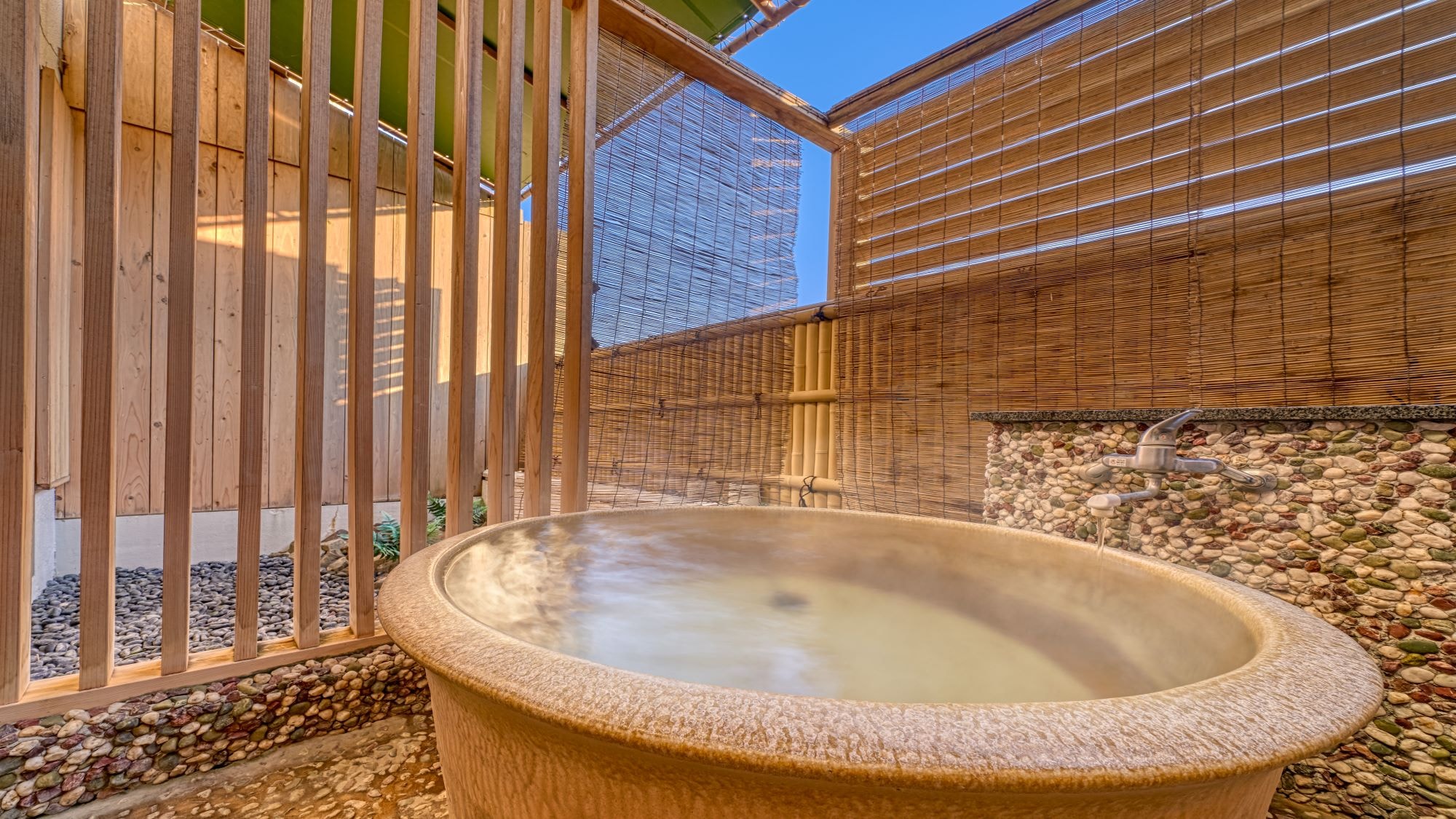 Standard Japanese-Western room with open-air bath *An example of an open-air bath in a guest room