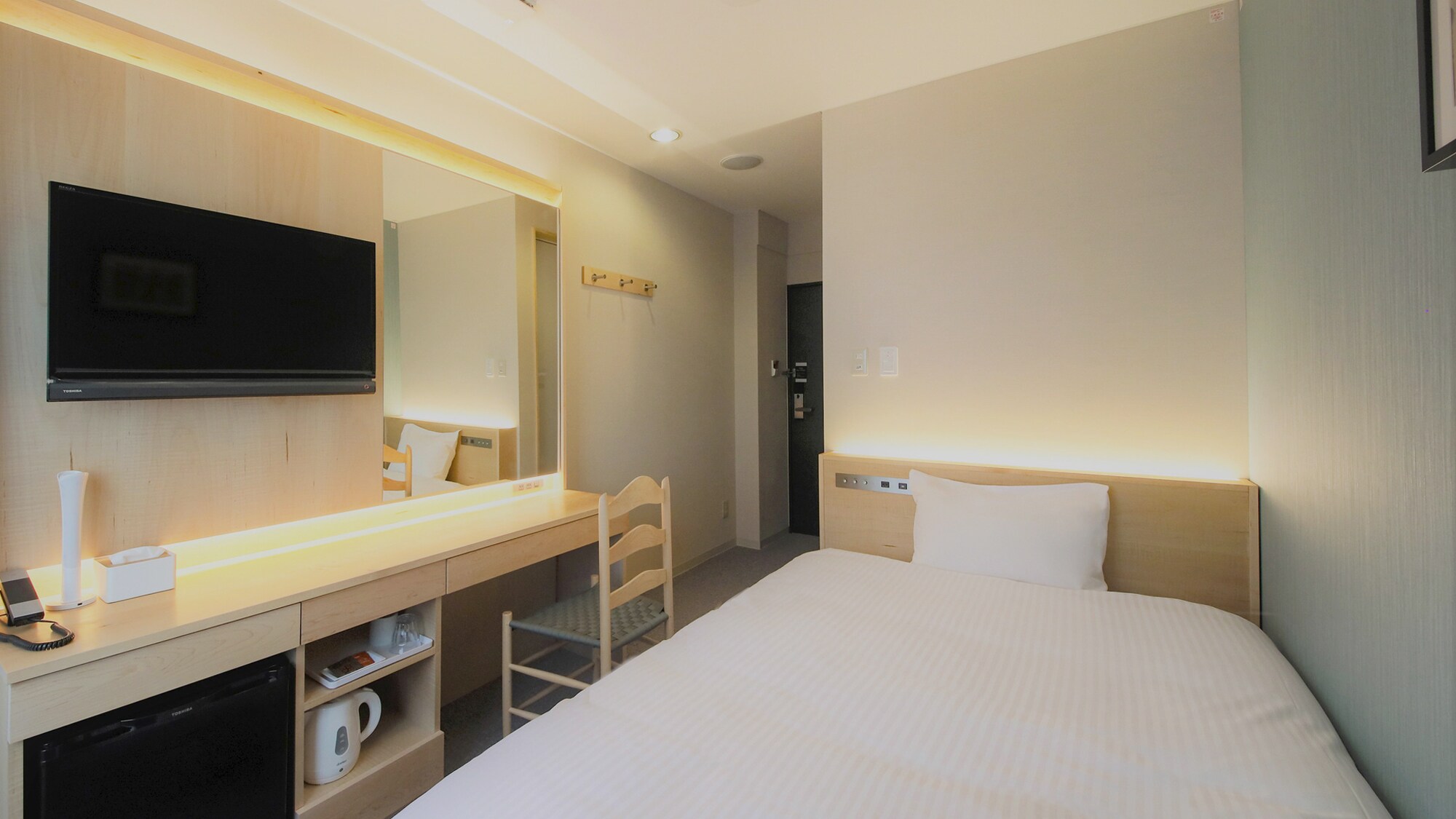 Single room with maple furniture