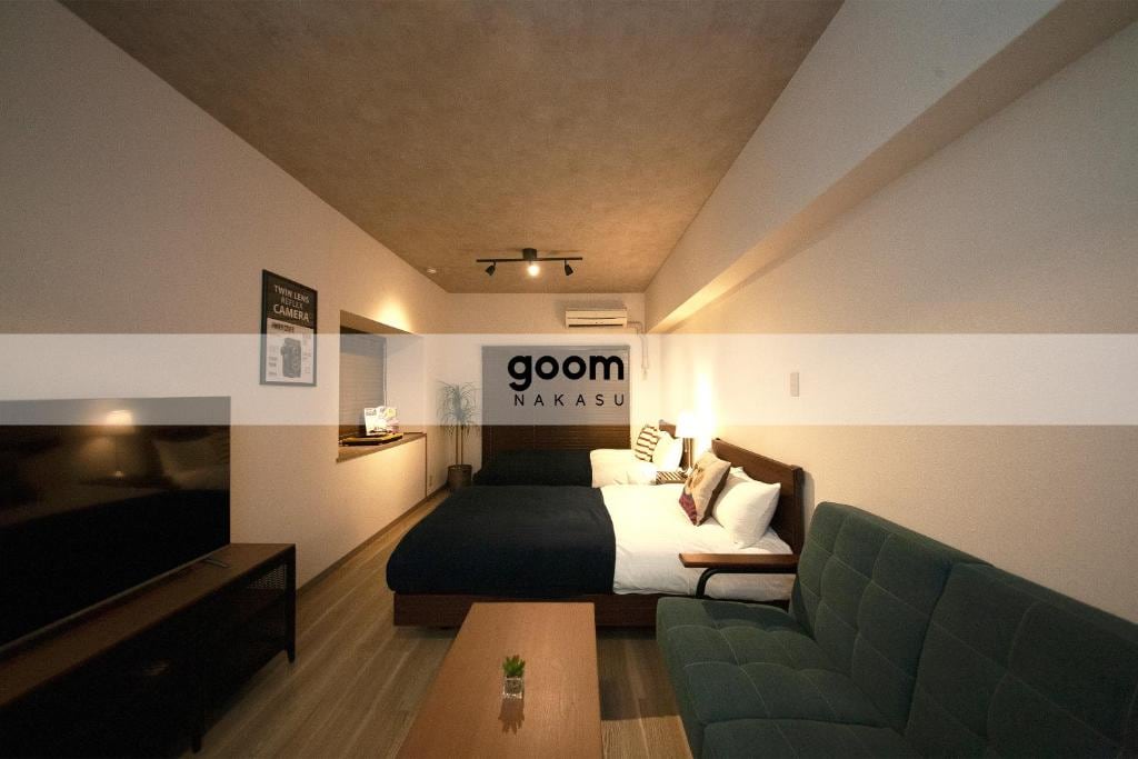 Deluxe room with 2 semi-double beds and sofa
