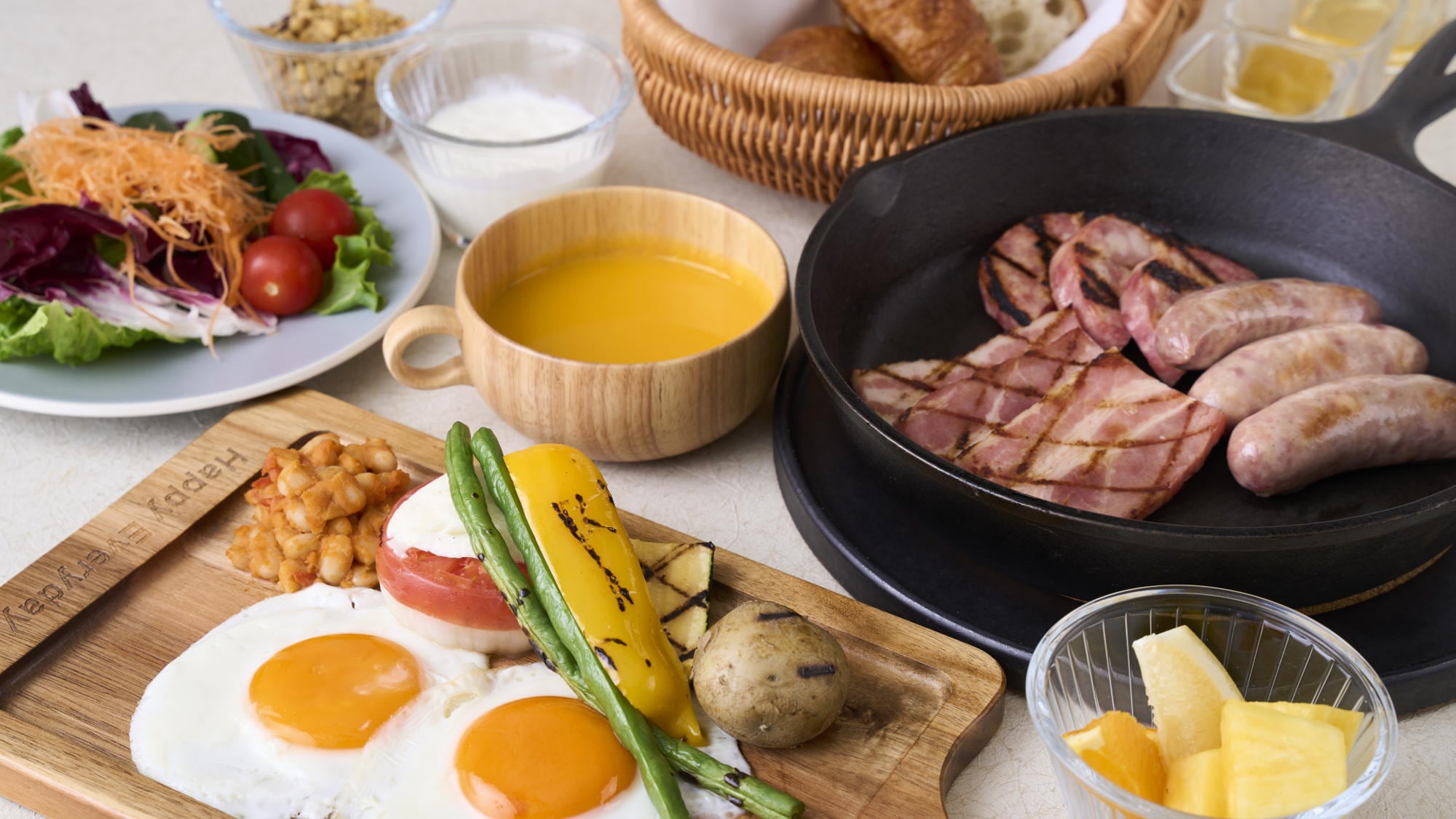 [Breakfast image] "Brekkie style" breakfast featuring sausages, bacon, fried eggs, and more served on one plate