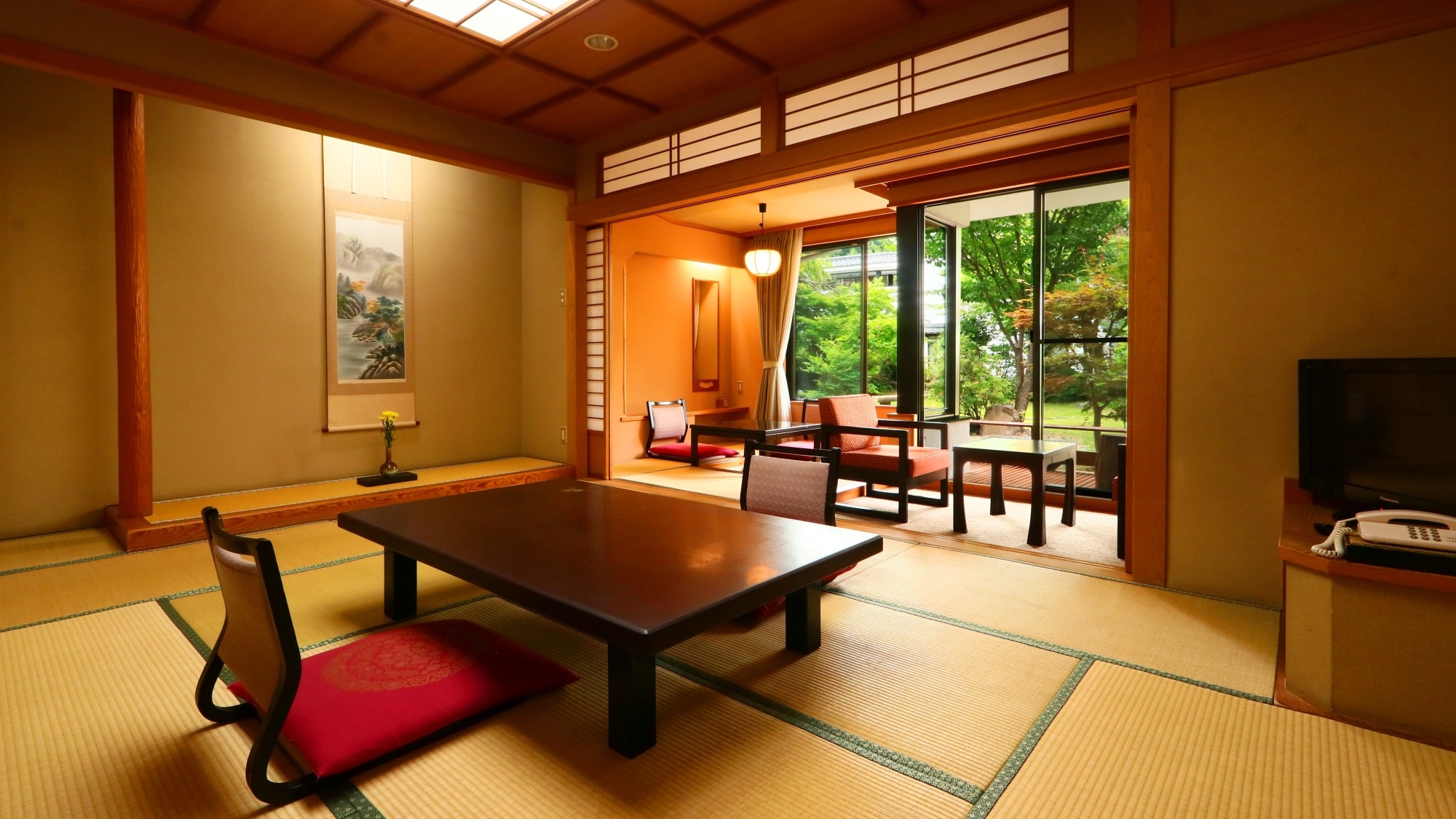 10 tatami Japanese-style room with a large window overlooking the garden