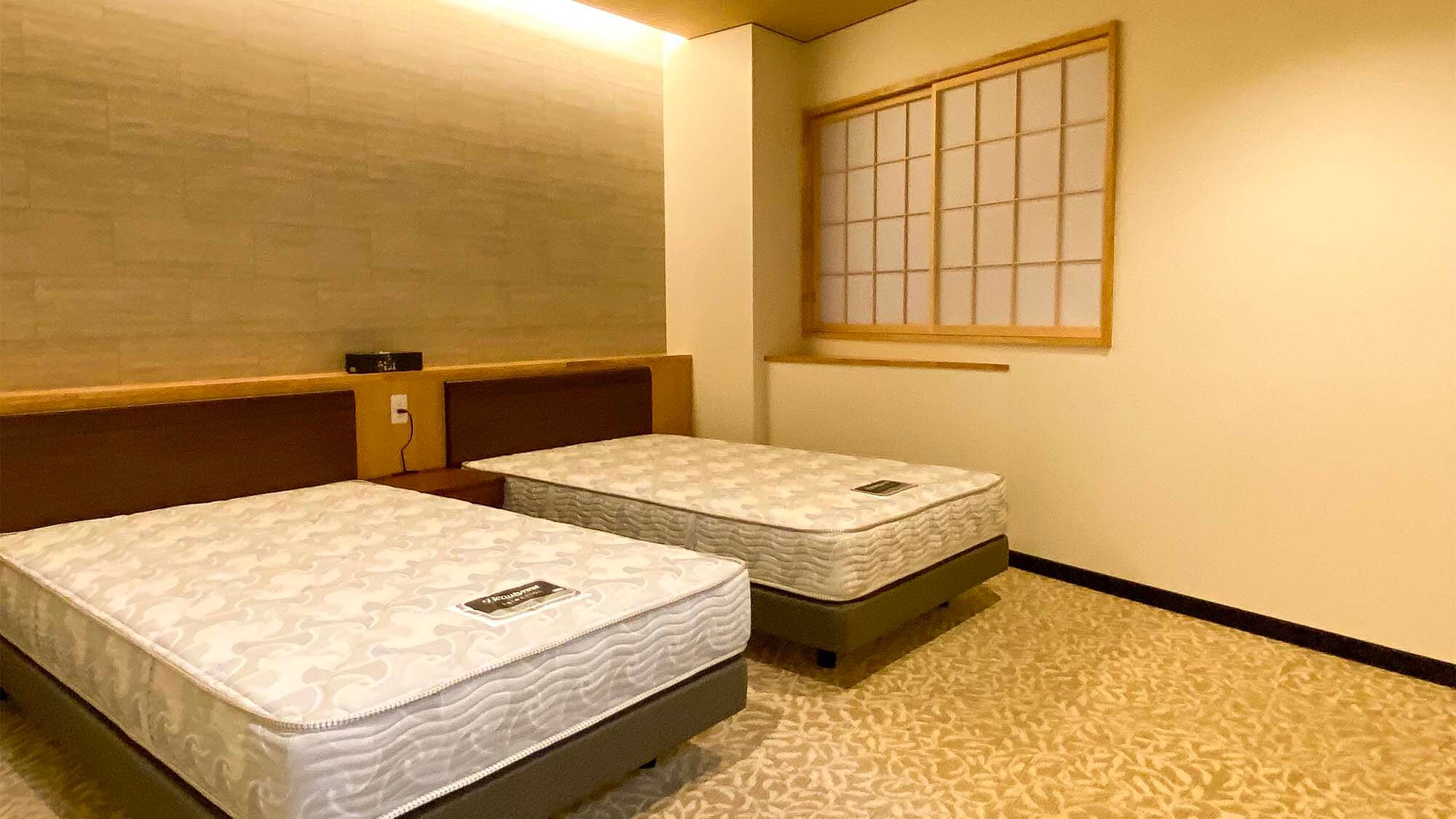 ・<特别日西式客房> 提供两张半双人床和被褥