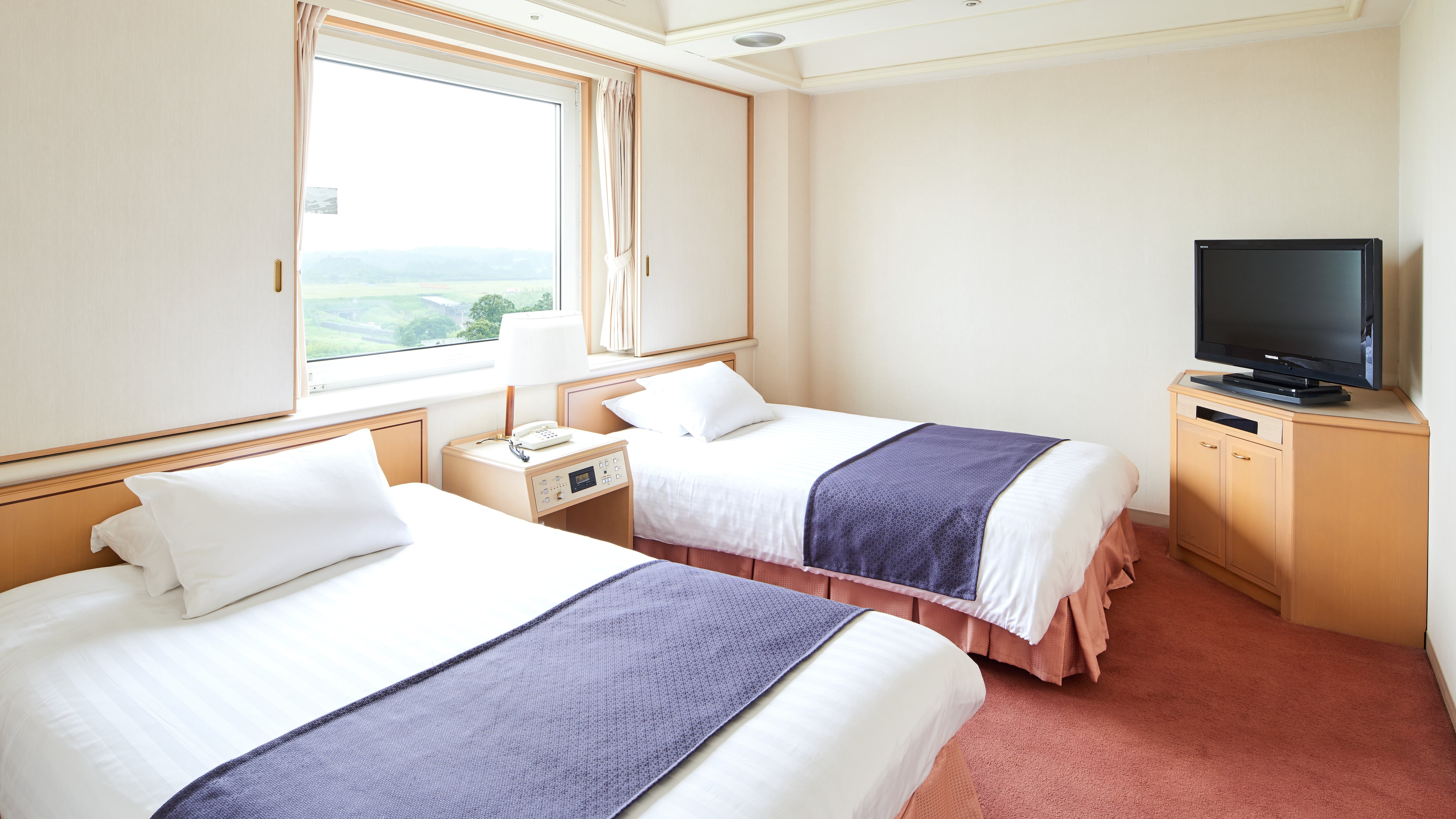 Phòng Deluxe 2 giường đơn cạnh giường
