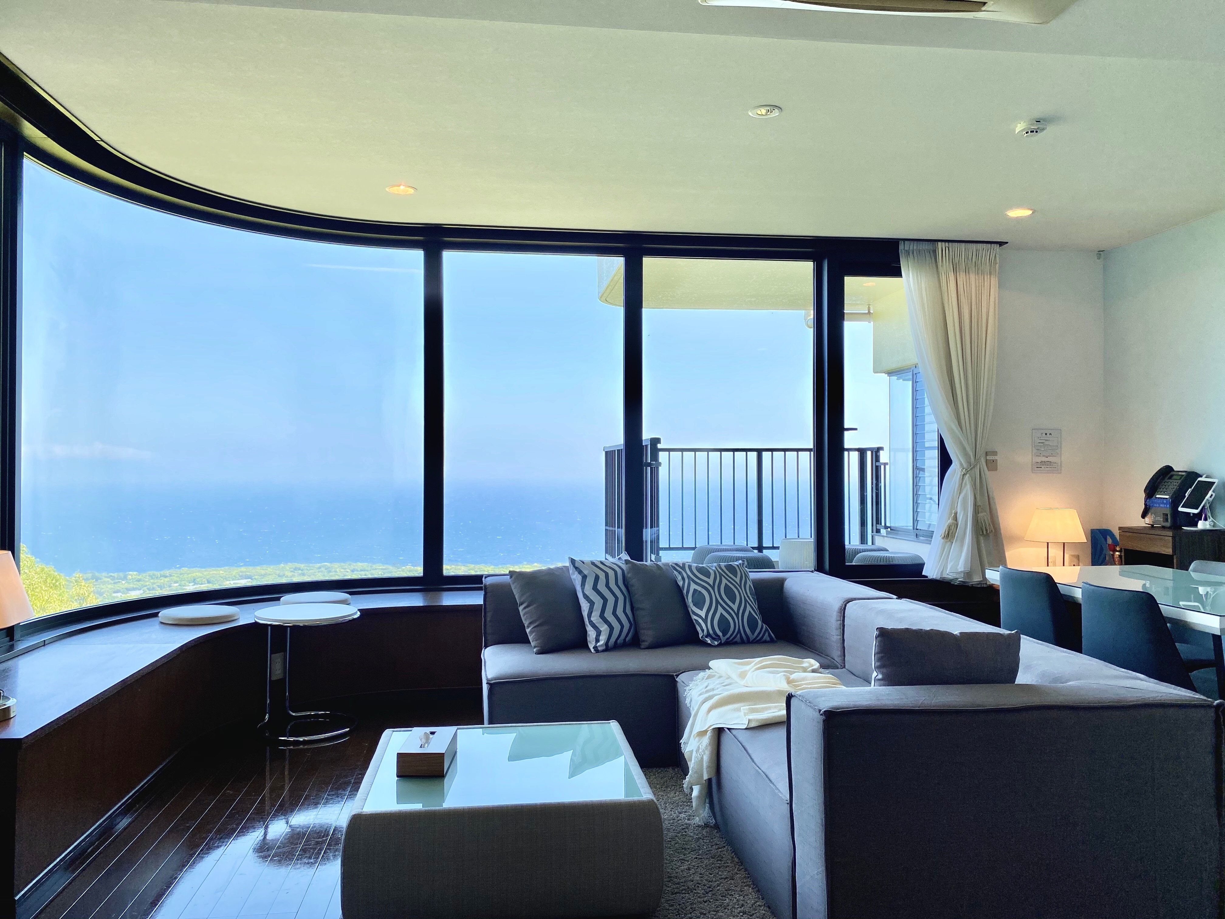A living/dining room with a spectacular view of Sagami Bay