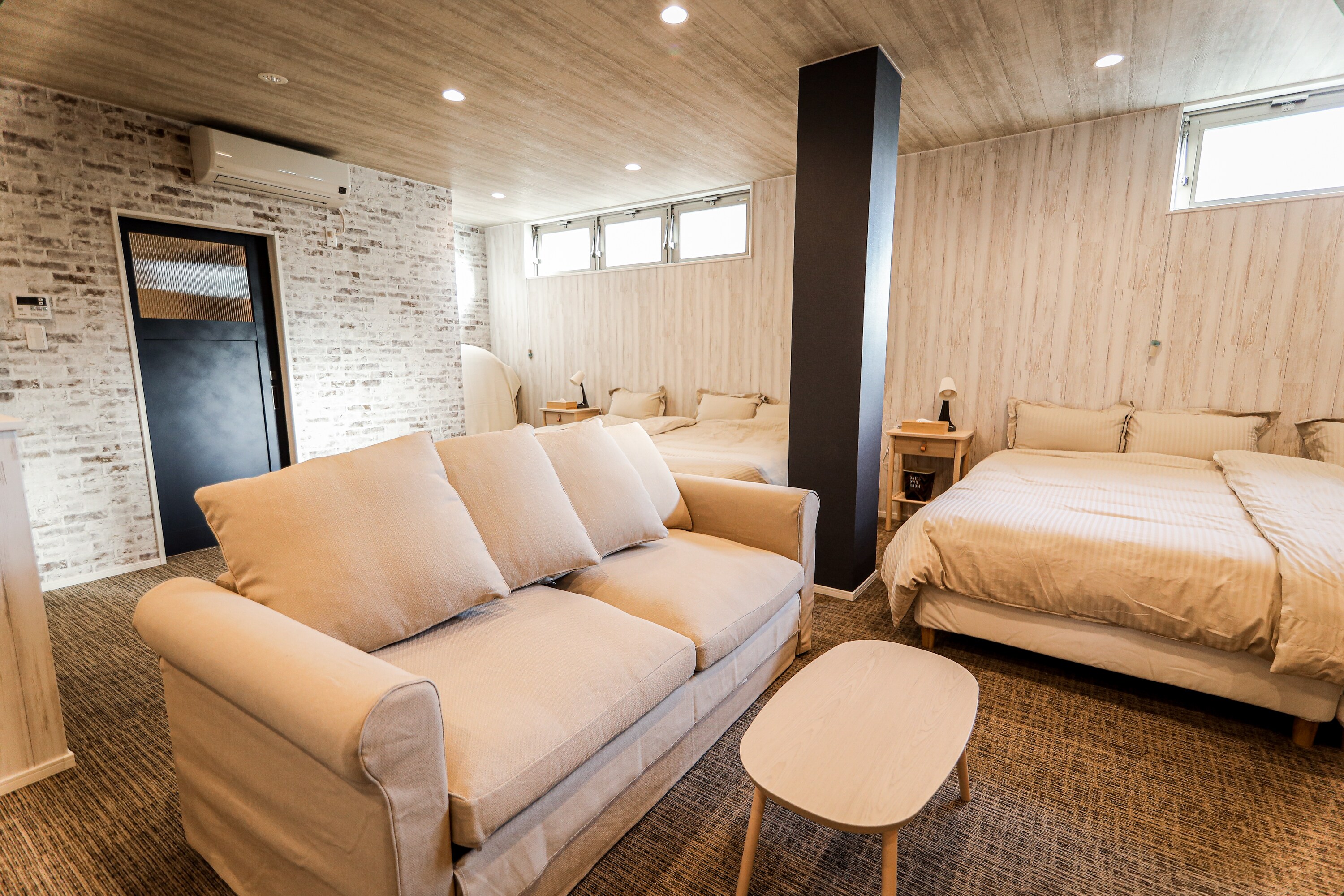 MQ1 room-3: The sofa has damage on the right side (left; left and right changed depending on the photo).