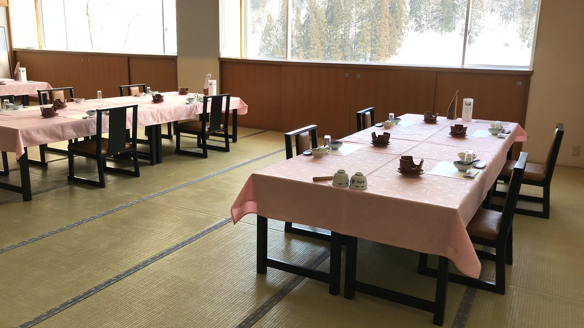 The restaurant has chairs and tables with plenty of space between the seats.
