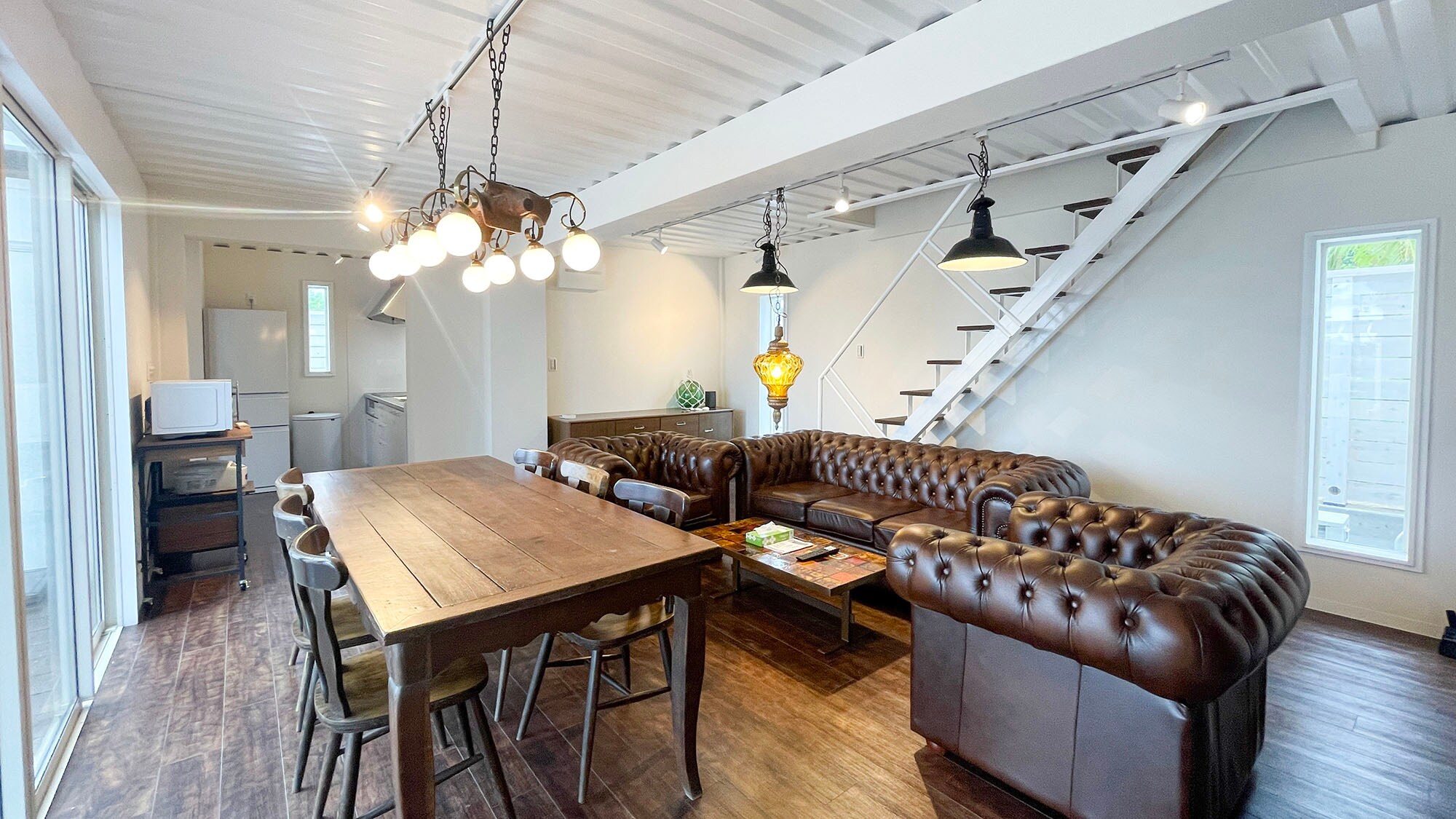 ・[Building A/Living and Dining Room] The kitchen is located at the back of the living and dining room.