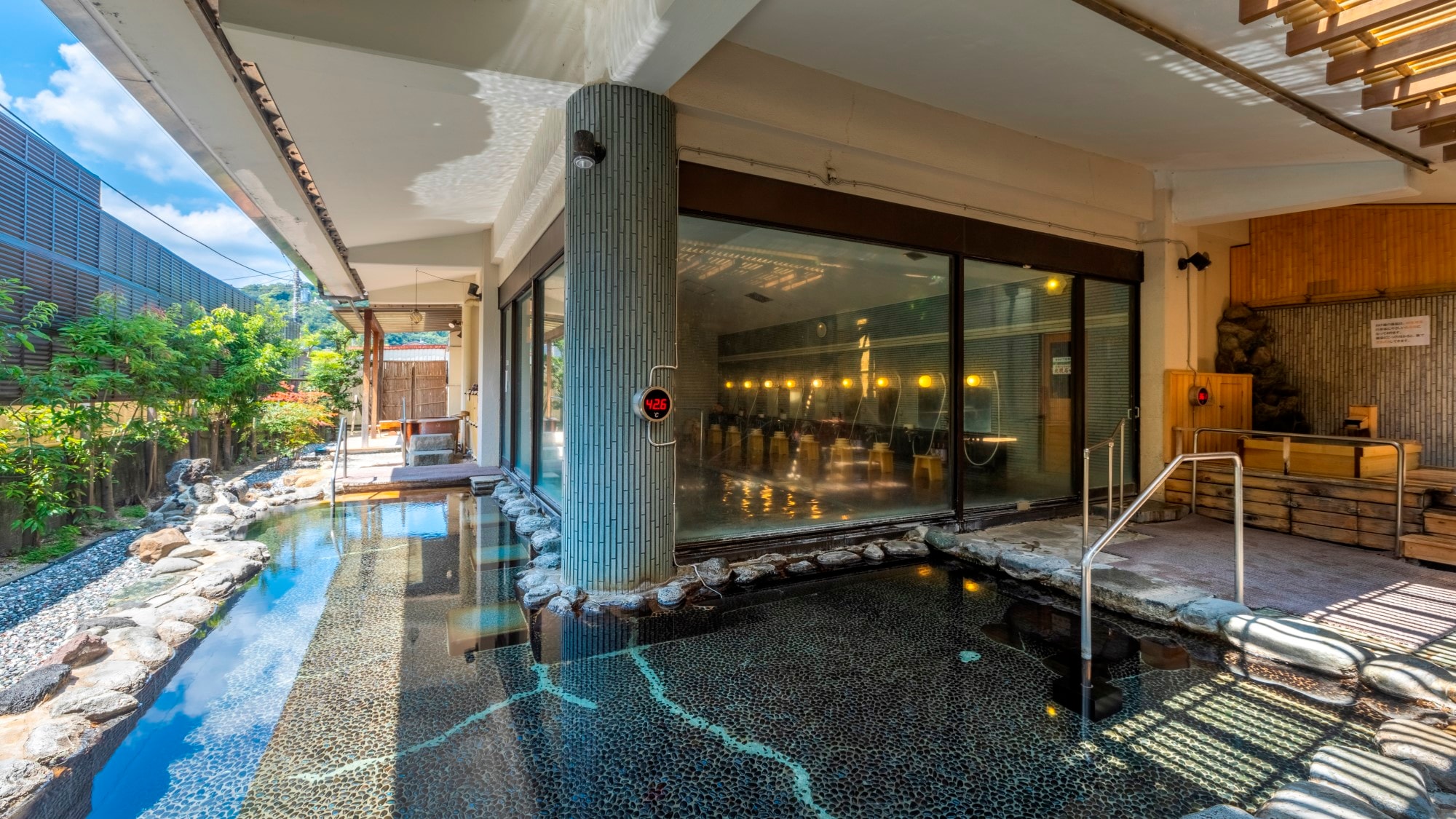 "Genji no Yu" open-air bath surrounded by lush greenery