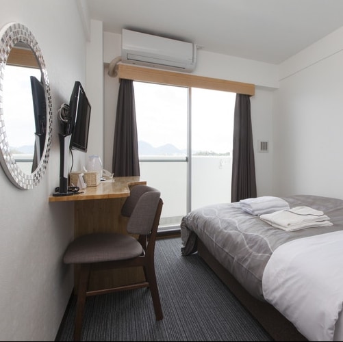 Double: A simple but stylish room with modern patterned bedspreads and interiors.