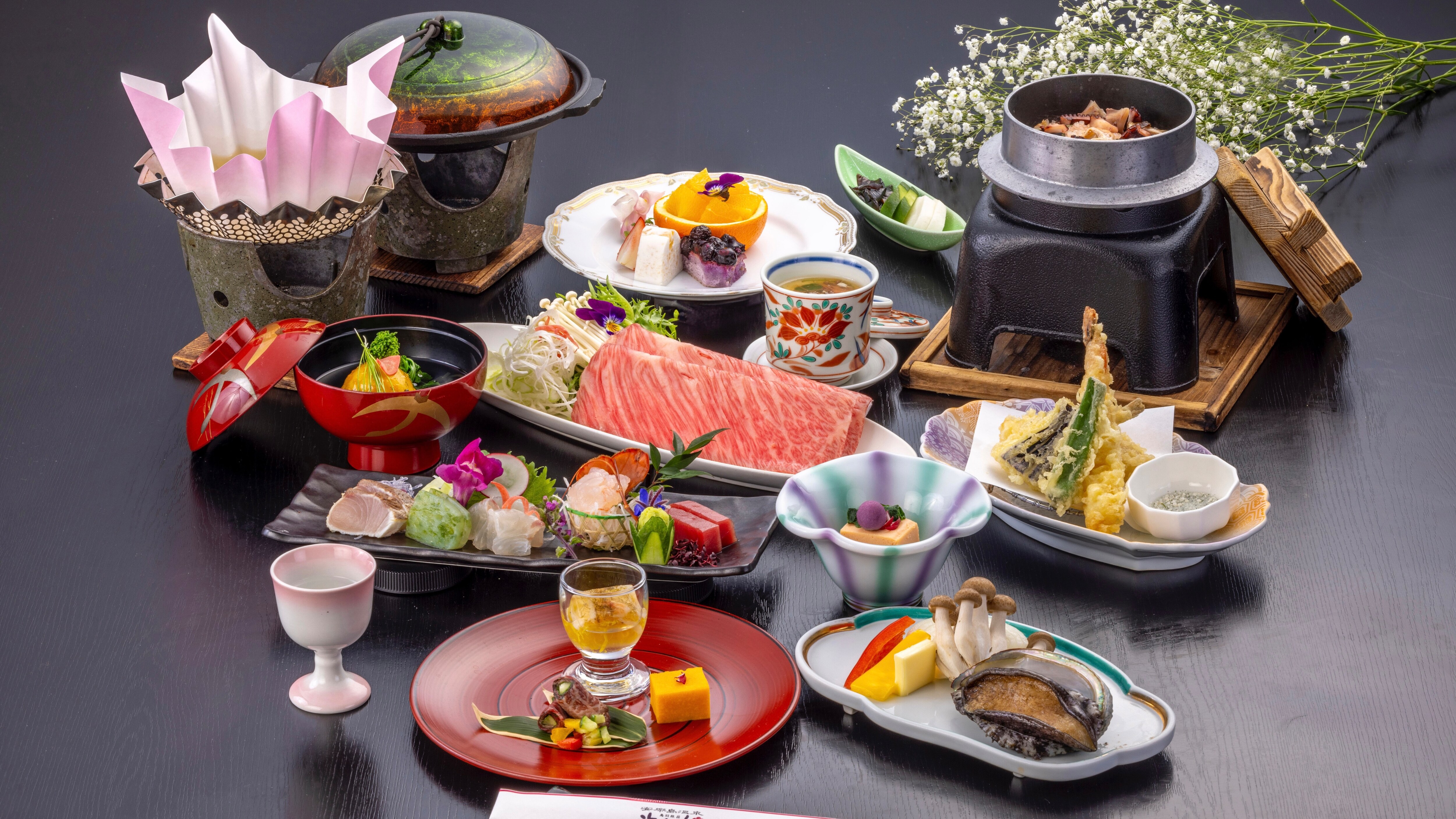 Kaiseki dinner with live abalone, Matsusaka beef, and spiny lobster sashimi