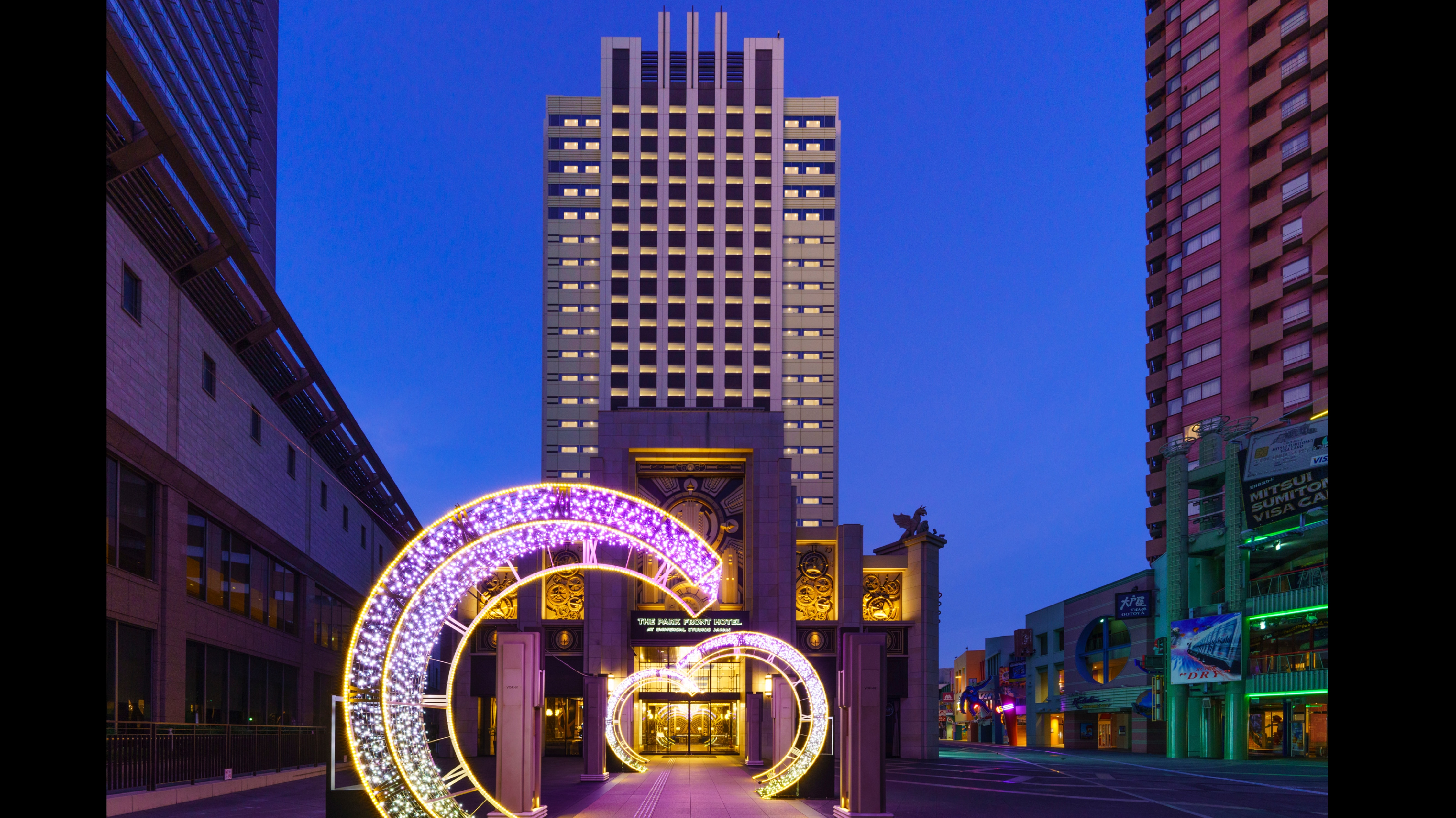 Hotel exterior. The entrance arch appears fantastic at night.