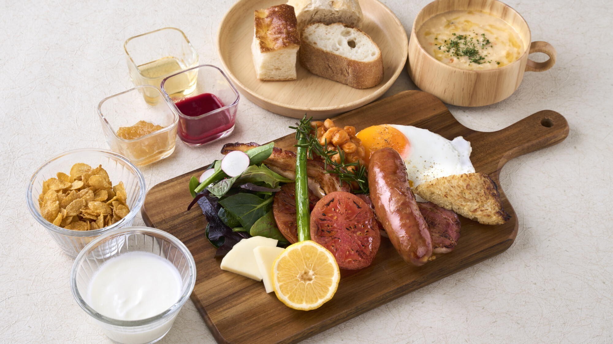 [Breakfast image] "Brekkie style" breakfast featuring sausages, bacon, fried eggs, and more served on one plate