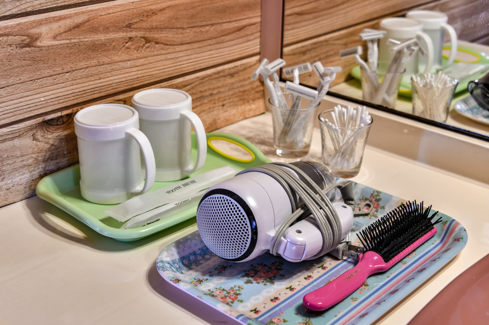 Hair dryer, hairbrush, razor, cotton swabs