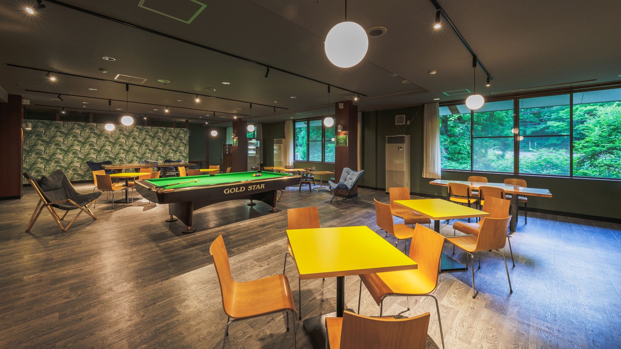 [Lounge TLJ] A renovated lounge equipped with a kitchen space, power outlets, a ping pong table, and a dining table.