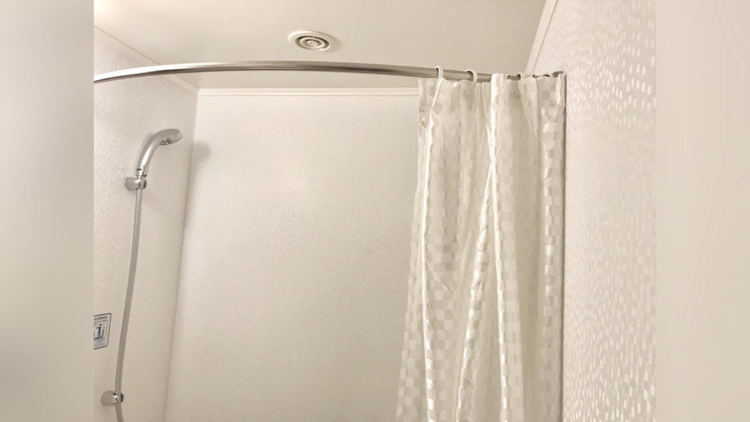 The curved pole makes it difficult for the curtain to hit your skin.