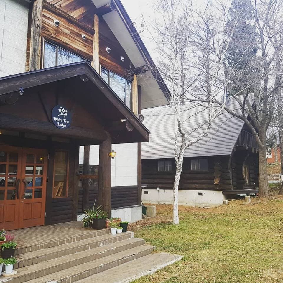 Exterior of the main building and log house