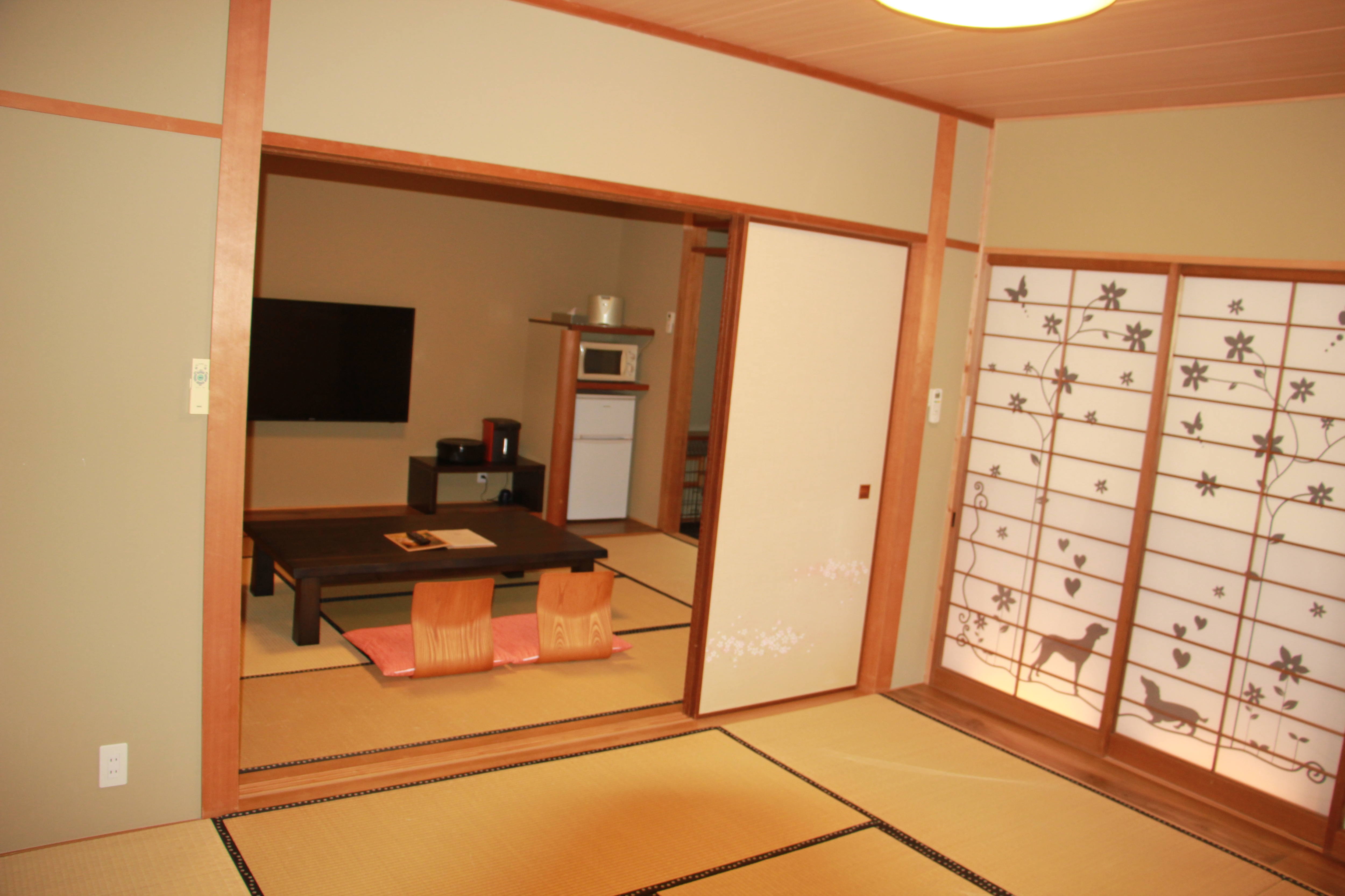 Two adjoining 16-tatami Japanese-style rooms, from the back