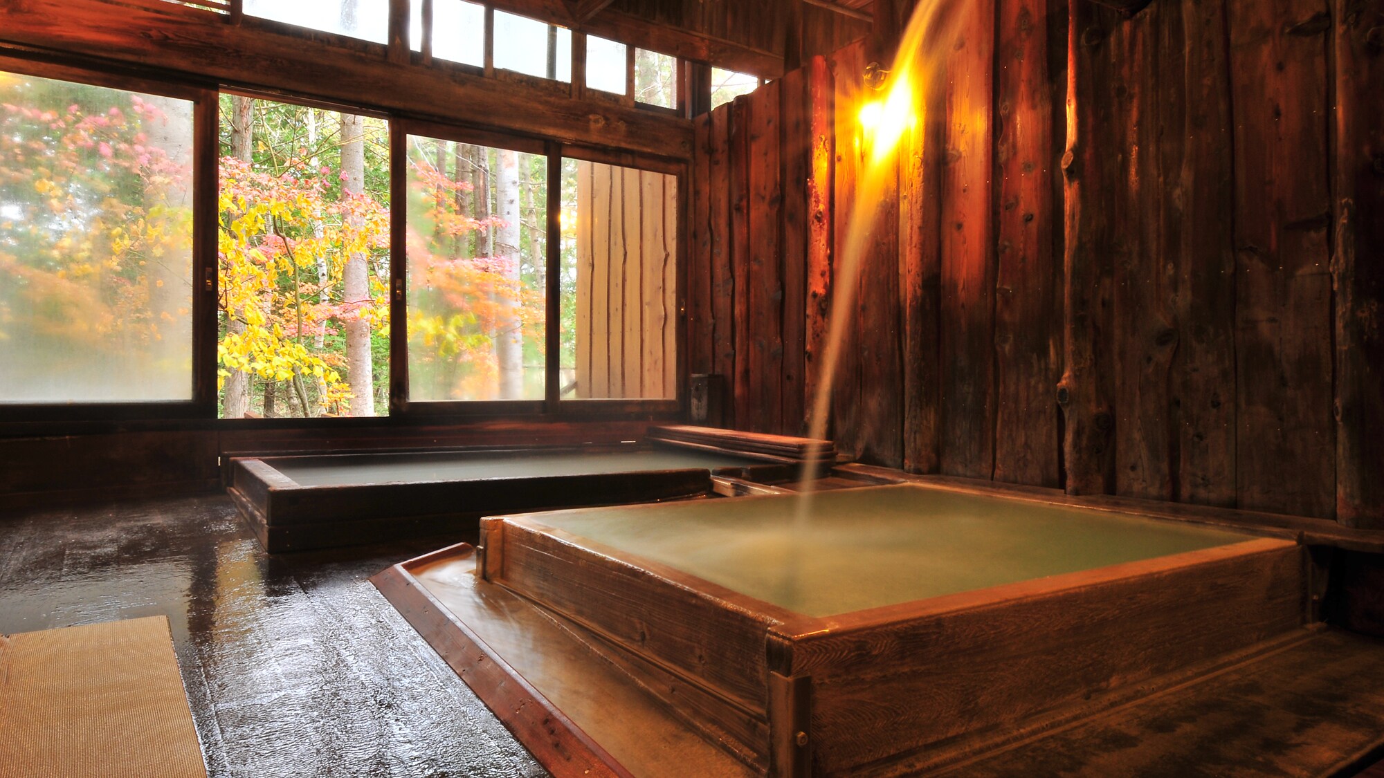 Shingen's medicinal bath. The water pours down like a waterfall, filling the elegant bathtub and turning it a milky bluish color.