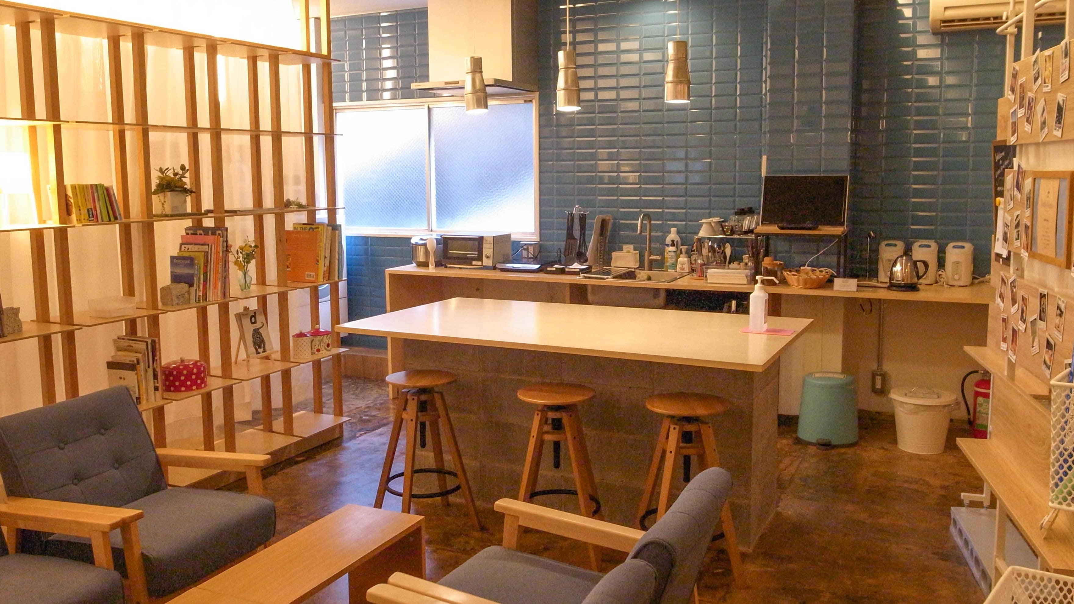 The shared space. The sofa space in the foreground is the lounge, and the back is the dining area and kitchen.