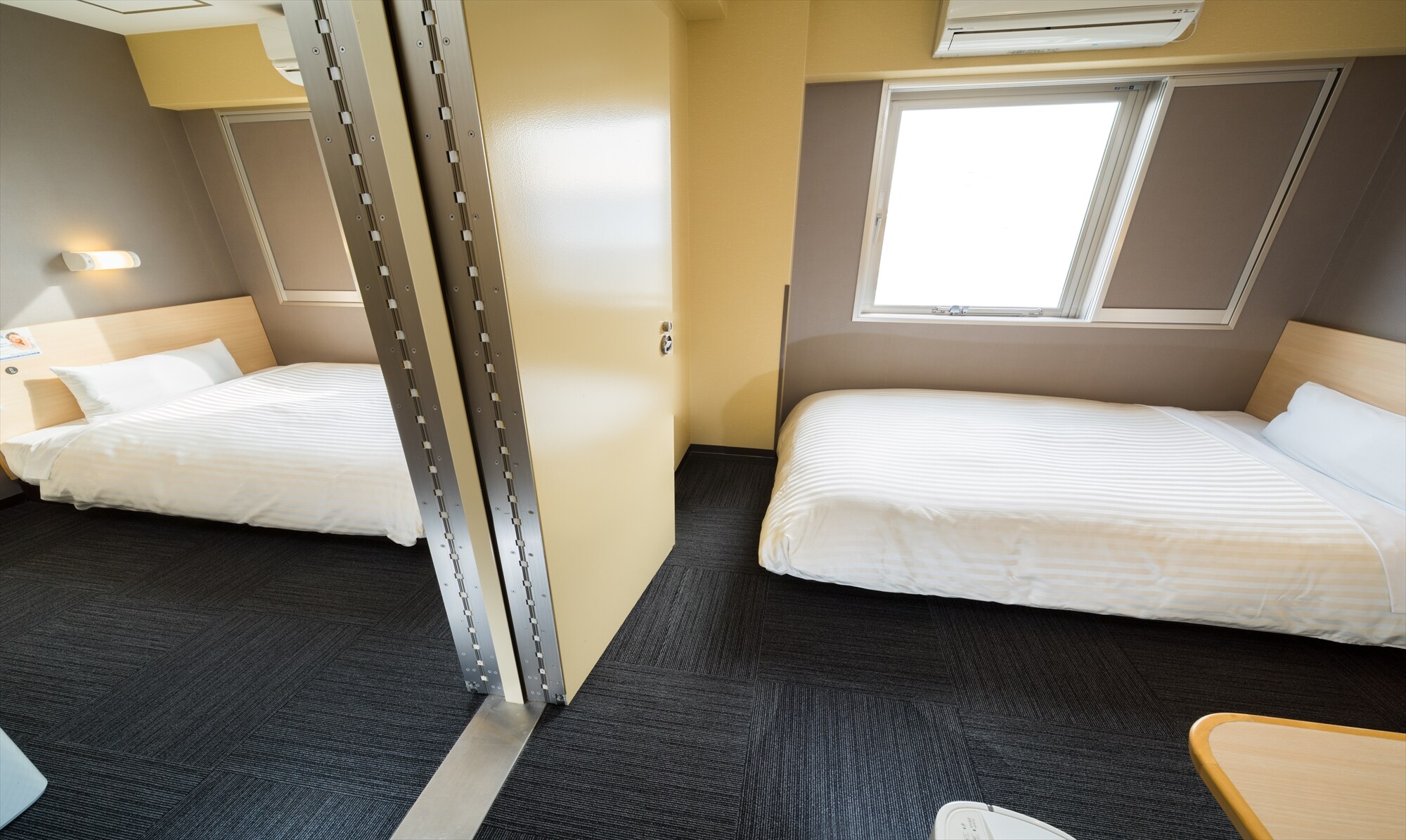 This room has two rooms with a door between them.