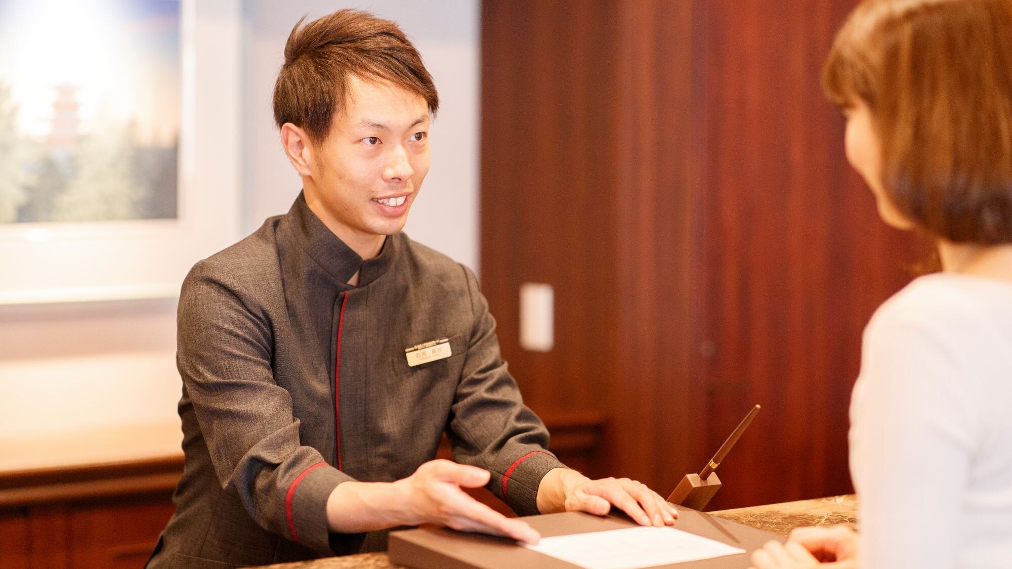 [Front Desk] The front desk welcomes guests.