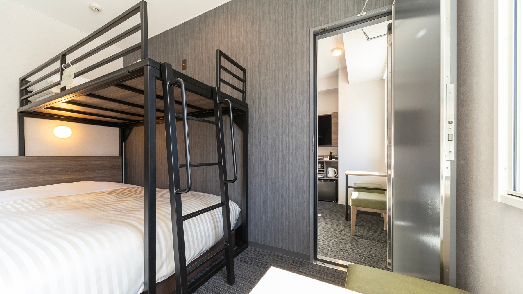 This room has two rooms with a door between them.