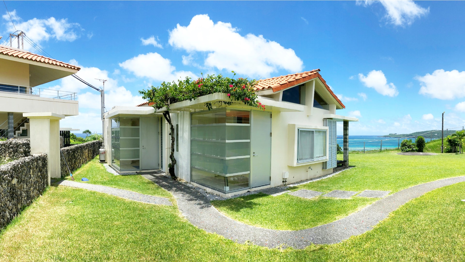 Green grass, blue sea and red tiles