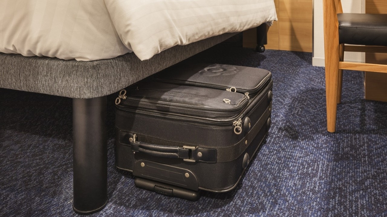Luggage suitcase under bed